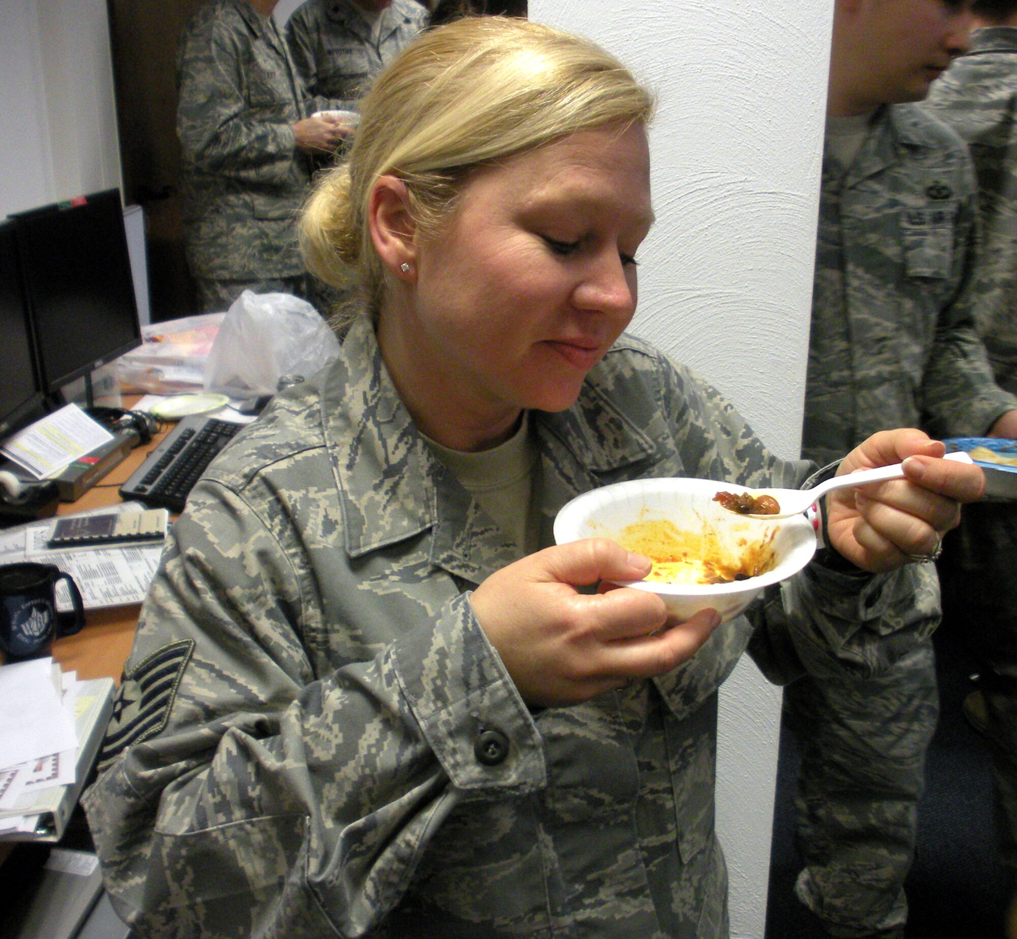 AIR BASE, Germany -- Tech. Sgt. Laura Jacobs, 617th Air and Space Operations Center, enjoys a bowl of chili during the 617th’s Chili Cook-off Jan. 29 here. Sergeant Jacobs presented the idea of a cook-off to show appreciation to the 603rd Air and Space Operations Center for thier support as the 617th constructed its AOC. Until the 617th facilities opened earlier this month in the 17th AF HQ, both units conducted operations from the 603rd's Ramstein facilities. The AOC’s also shared training and operational expertise as the 617th prepared to assume command and control responsibilities in the African area of activity. 

In addition to food and festivities, the 617th offered a tour of their new AOC. (U.S. Air Force photo by Master Sgt. Jim Fisher)