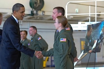 President Barack Obama shakes the hand of Senior Airman Brooke Lohr Jan. 28, 2010, at MacDill Air Force Base, Fla.  President Obama and Vice President Joe Biden briefly met with Airmen providing aeromedical evacuation support to victims of the recent earthquake in Port-au-Prince, Haiti.  Airman Lohr is a cardiopulmonary technician deployed from the 88th Medical Group at Wright-Patterson AFB, Ohio. She and fellow critical care air transport team member, Capt. Jeffery Marsh (second from right), were among the Airmen thanked by the president for their direct support to Operation Unified Response. (U.S. Air Force photo/Staff Sgt. Joseph Swafford)