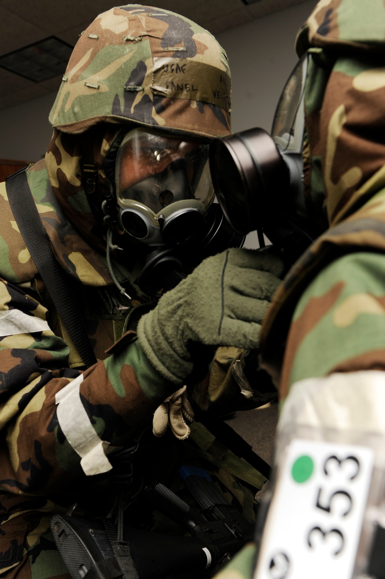 SCOTT AIR FORCE BASE, Ill. – Airman 1st Class Sanel Velic, 133rd Communications Flight knowledge operations manager, performs a buddy check on Senior Airman Matthew Ingebrand, 133rd Communications Flight knowledge operations manager, to make sure his gas mask is on tight and there are no gaps in his jacket January 25, 2010 as part of the Operational Readiness Exercise held at Volk Field Combat Readiness and Training Center, Wis. The buddy check is one of the most important steps in putting on your MOPP gear as it ensure that you are properly wearing it so you are protected from any chemicals that may be in the air. (U.S. Air Force photo/Senior Airman Wesley Farnsworth)