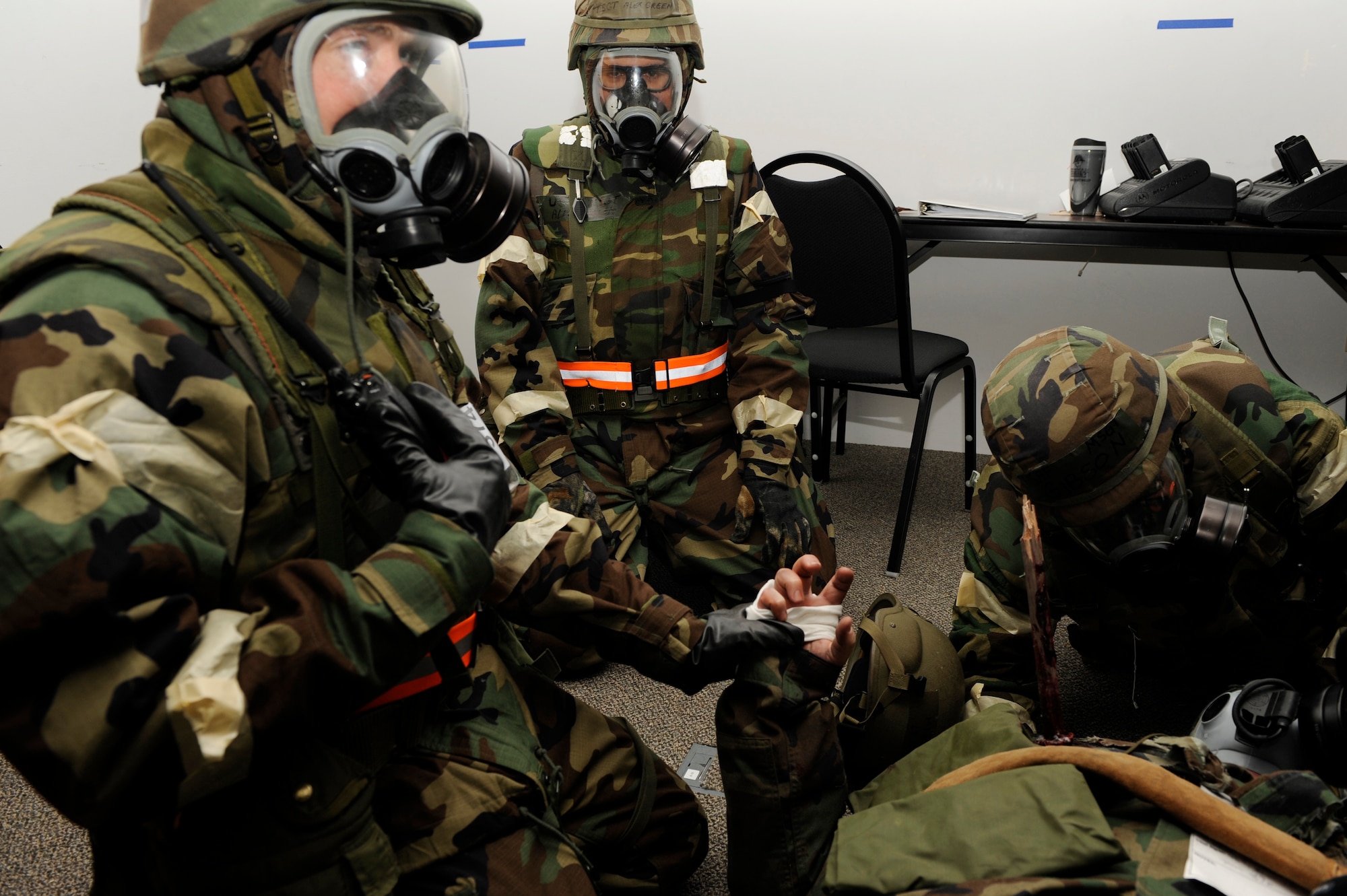 SCOTT AIR FORCE BASE, Ill. – Airmen practice their Self Aid Buddy Care as their Wingman lays on the floor with an impaled object coming out of his chest January 25, 2010 during he Operational Readiness Exercise held at Volk Field Combat Readiness and Training Center, Wis. With the practice of SABC Airmen are able to secure impaled objects, treat head wounds and perform procedures like managing a cut until proper medical attention can be provided by trained medics. (U.S. Air Force photo/Senior Airman Wesley Farnsworth)
