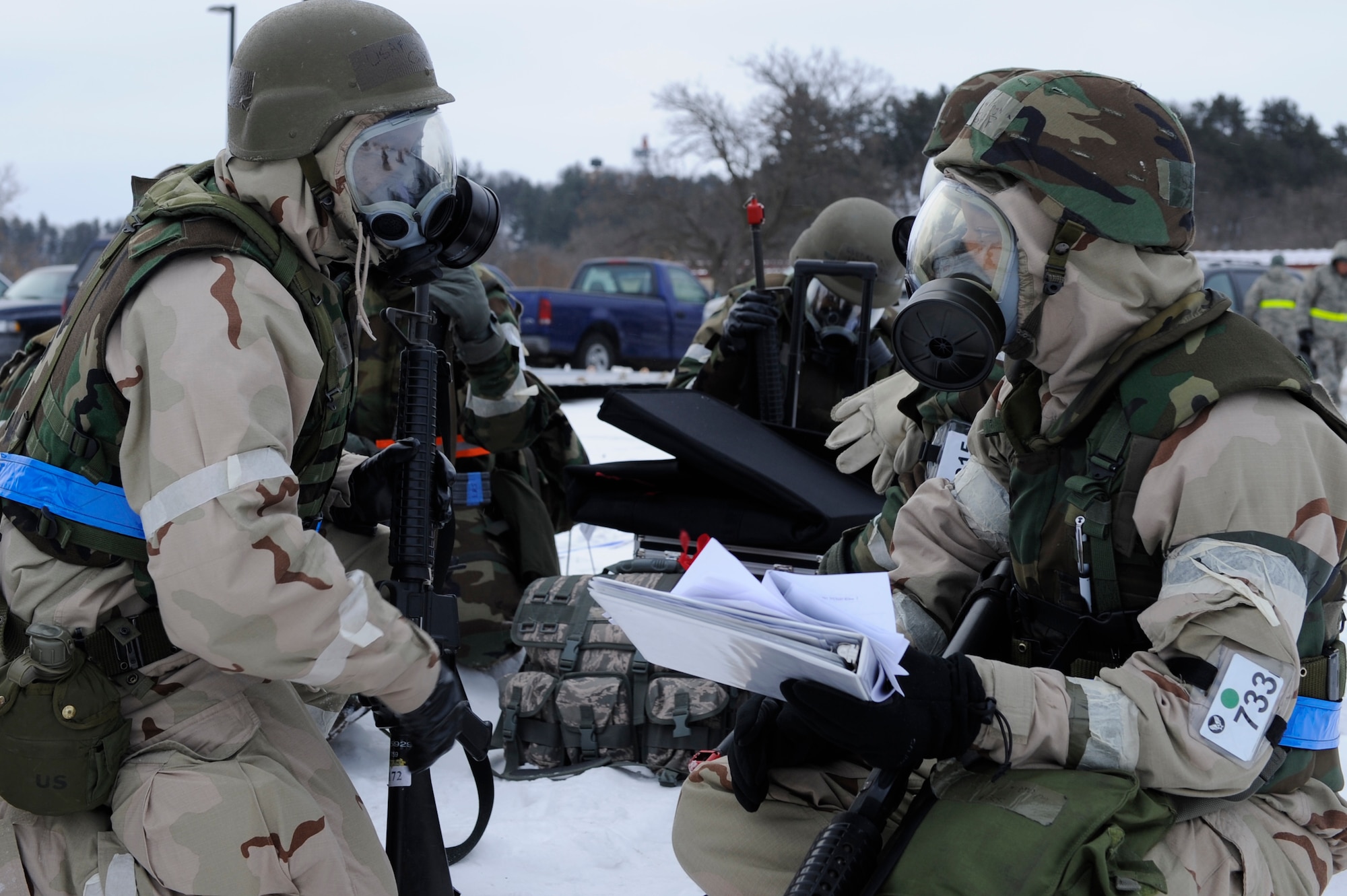 SCOTT AIR FORCE BASE, Ill. – Staff Sgt. Dominique Waithe-Cunningham, 375th Communications Squadron base records manager, and Staff Sgt. Chris Cauthen 375th Communication Squadron knowledge operations, take accountability of all personnel inside their bunker after having to evacuate the building due to a simulated fire January 25, 2010, during the Operational Readiness Exercise held at Volk Field Combat Readiness and Training Center, Wis. In the event of an evacuation airmen are assigned to different bunkers so that accountability may be done quickly and efficiently. (U.S. Air Force photo/Senior Airman Wesley Farnsworth) 
