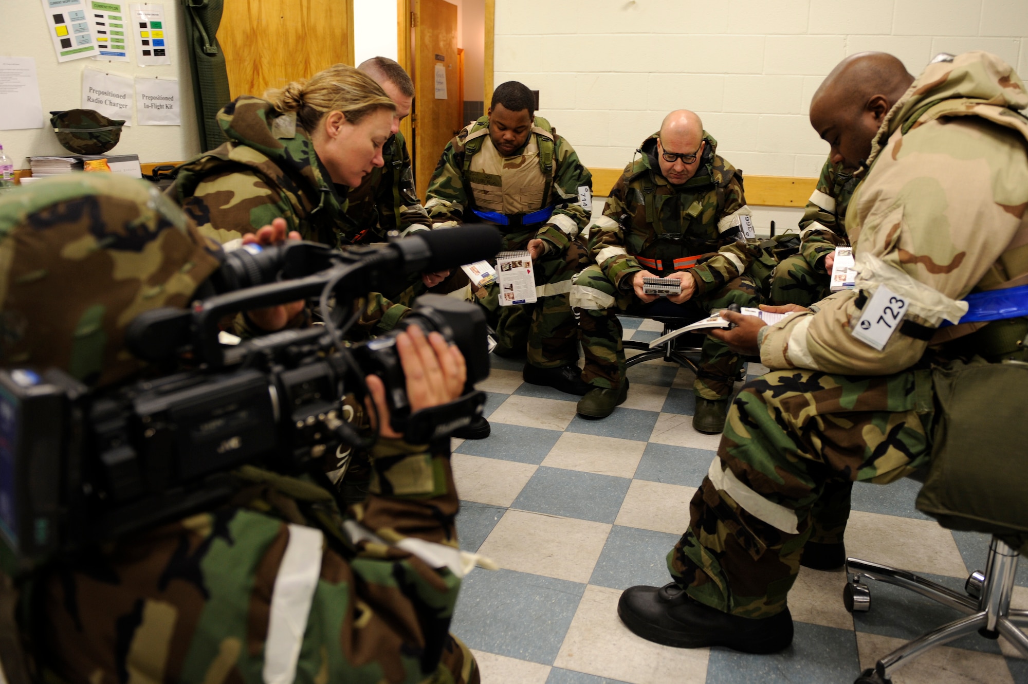 SCOTT AIR FORCE BASE, Ill. – A group of Airmen review the material in their Airman’s Manuals January 25, 2010, as part of the Operational Readiness Exercise held at Volk Field Combat Readiness and Training Center, Wis. The Airman’s Manual is a pocket guide to everything military including self-aid buddy care procedures, and how to correctly identify unexploded explosive ordnances. (U.S. Air Force photo/Senior Airman Wesley Farnsworth) 