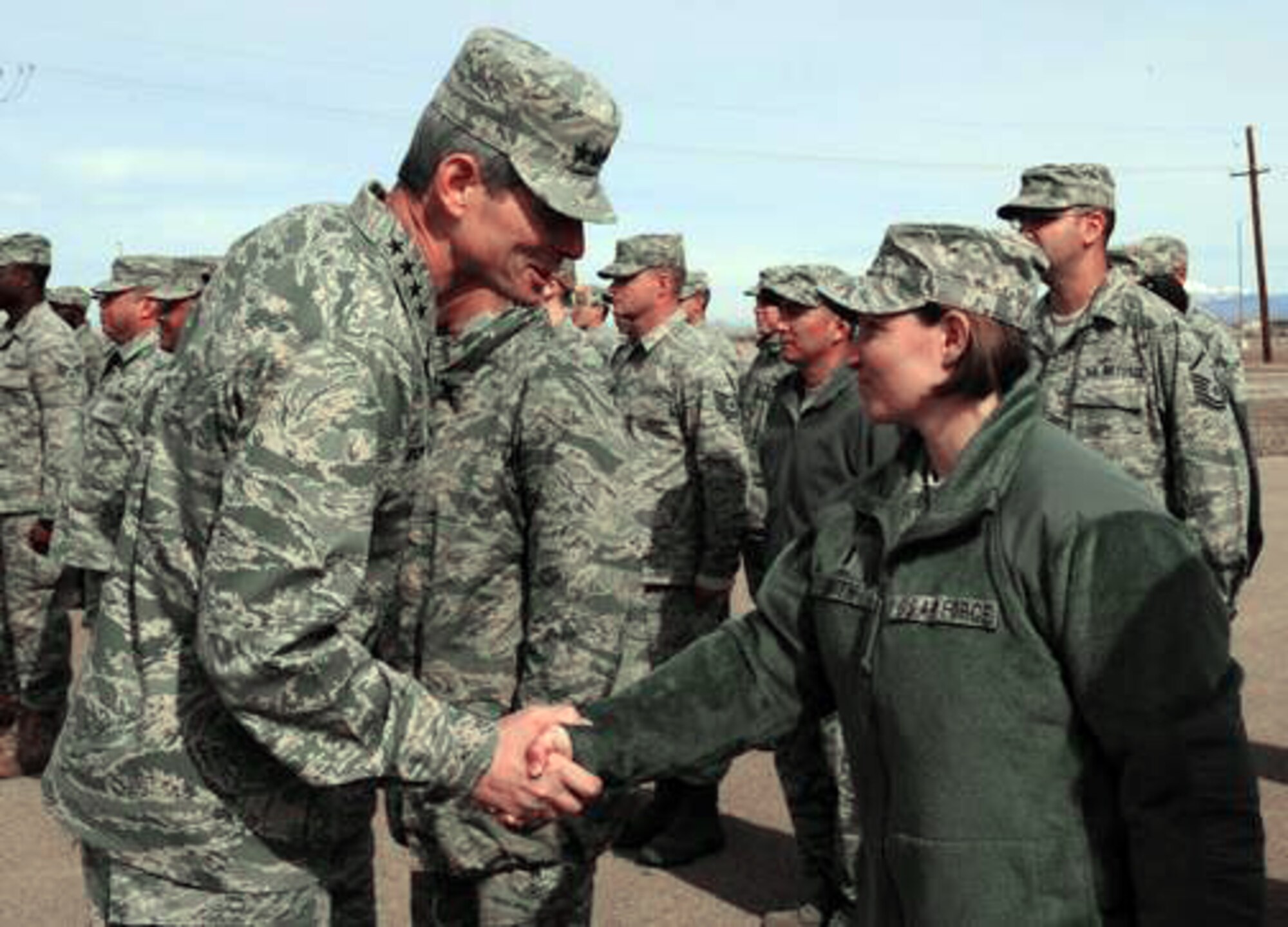 Air Force Chief of Staff Gen. Norton Schwartz shakes hands with 2nd Lt. Victoria Smith Jan. 27, 2010, at Holloman Air Force Base, N.M. General Schwartz visited Holloman AFB to see Airmen and operations firsthand. Lieutenant Smith is assigned to the 49th Material Maintenance Support Squadron. (U.S. Air Force photo/Senior Airman Tiffany Trojca)