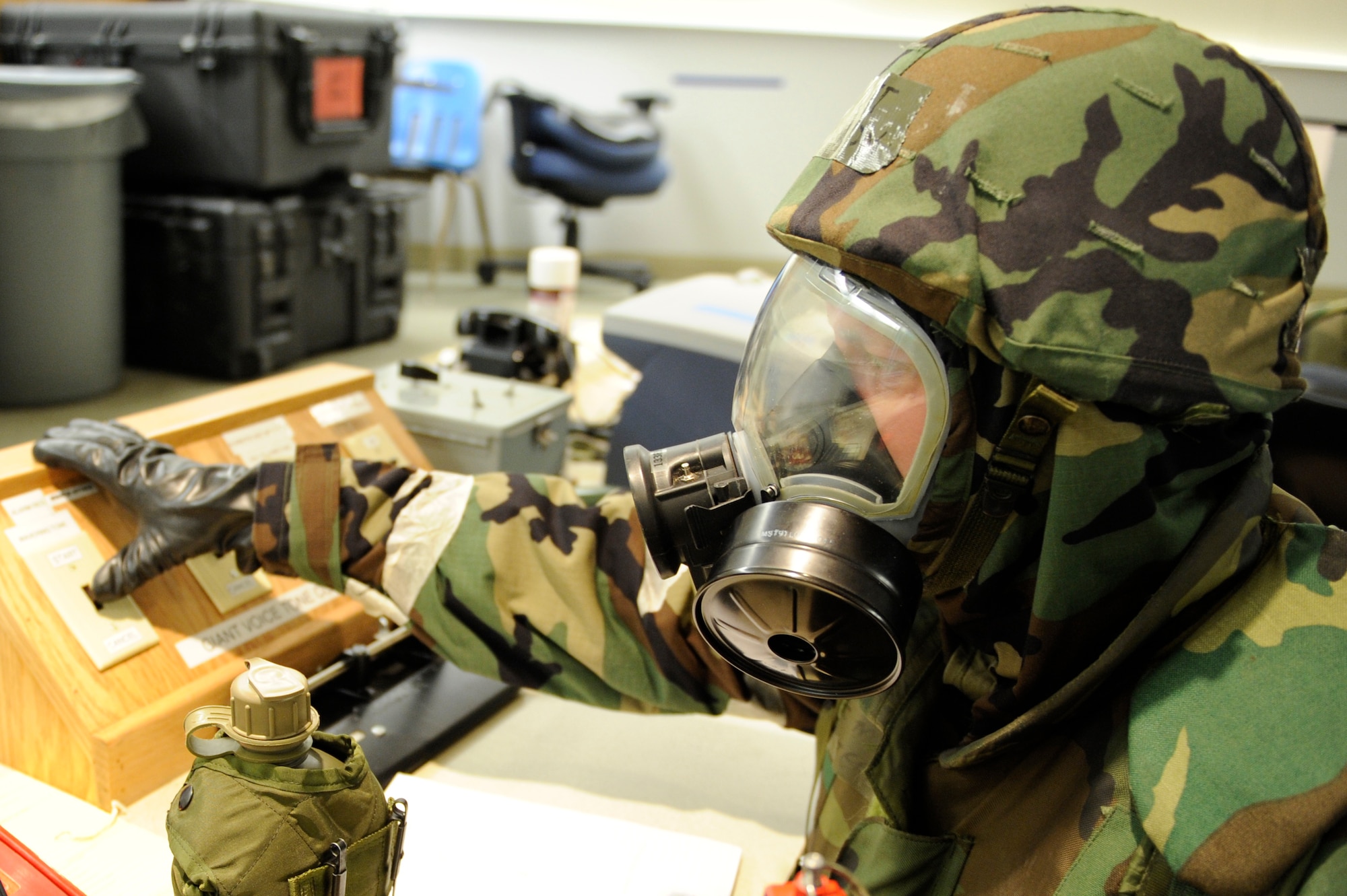 SCOTT AIR FORCE BASE, Ill. – Master Sgt. Dave Peterson, 133rd Airlift Wing Command Post controller, flips the switch to sound the “alarm black” siren on base January 25, 2010, as part of the Operational Readiness Exercise at Volk Field Combat Readiness and Training Center, Wis. “Alarm black” means that the previous attack is now over and/or there are unexploded objects suspected in the area. (U.S. Air Force photo/Senior Airman Wesley Farnsworth) 