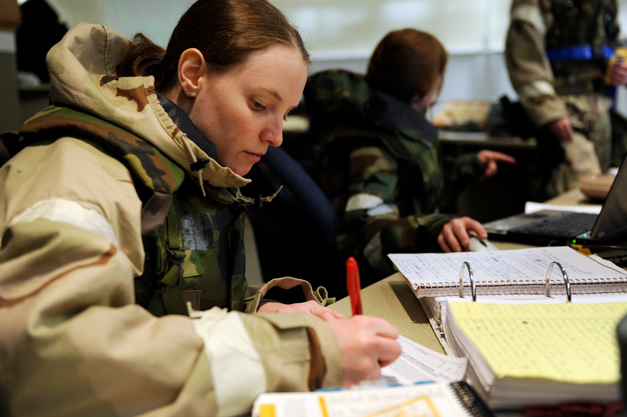 SCOTT AIR FORCE BASE, Ill. – Senior Airman Kristin Pratt, 375th Judge Advocate General paralegal, transcribes paperwork January 25, 2010, as part of the Operational Readiness Exercise at Volk Field Combat Readiness and Training Center, Wis. During the ORE Airmen were able to work on fine-tuning their combat skills in preparation for the Operational Readiness Inspection in March. (U.S. Air Force photo/Senior Airman Wesley Farnsworth) 