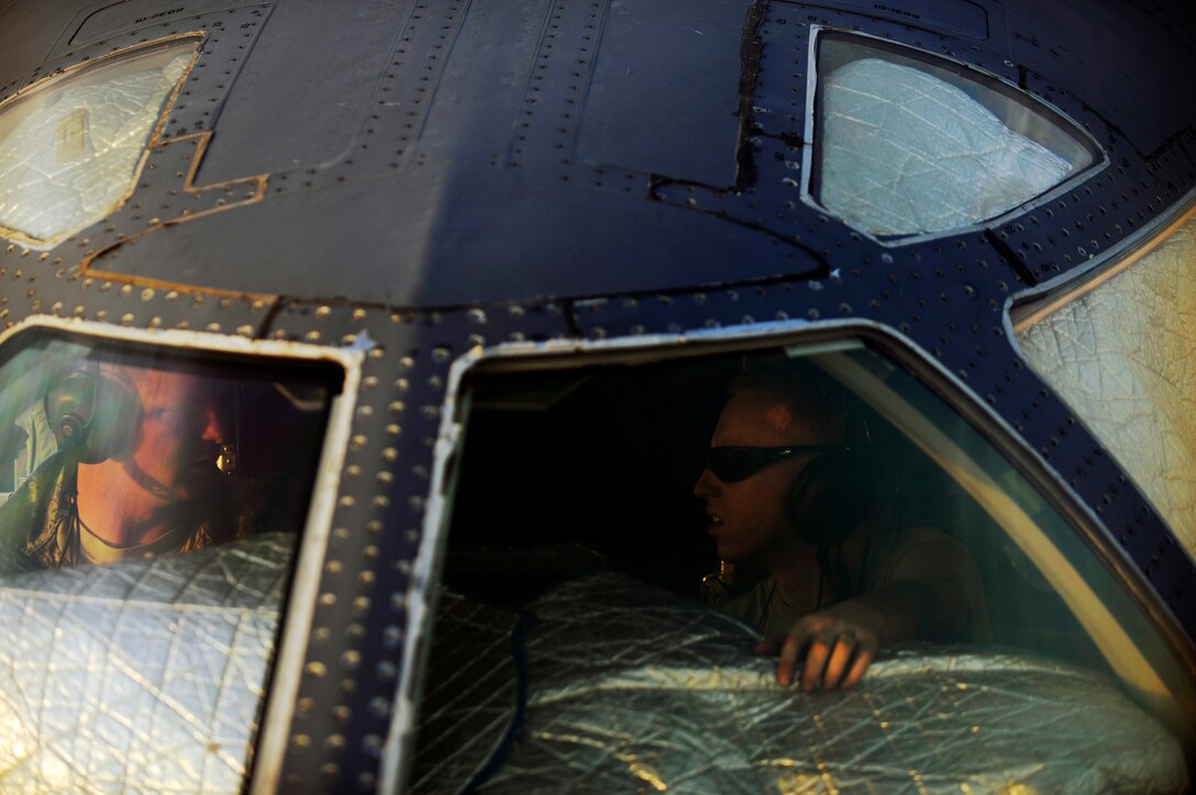 Senior Airman Michael Larrea, an avionics journeyman, and Staff Sgt. Billy Truelove, a crew chief, both assigned to the 37th Aircraft Maintenance Unit, troubleshoot the communications system of a B-1B Lancer Jan. 24, 2010, in Southwest Asia. The 37th EBS Airmen returned home to Ellsworth, S.D., Jan. 27, 2010, following a six-month deployment.(U.S. Air Force photo/Staff Sgt. Manuel J. Martinez/Released)
