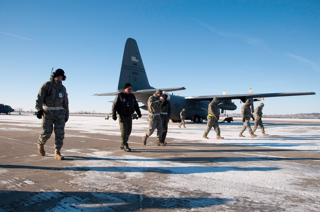 139th Airlift Wing maintenance members perform a foreign object debris (FOD) check during a unit compliance inspection, in sub-zero temperatures on January 10, 2010. (U.S. Air Force photo by Master Sgt. Shannon Bond) 