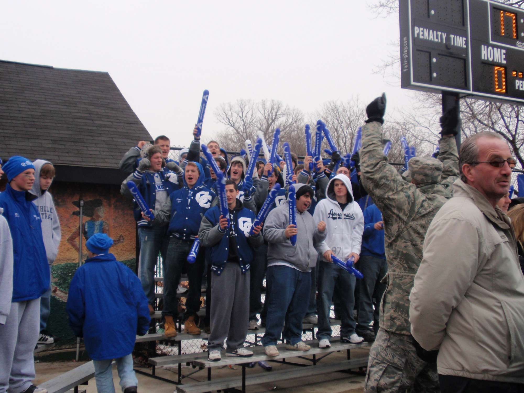 Staff Sgt. Michael De La Rosa, recruiter in Mt. Clemens, MI., fires up the Detroit Catholic Central Crowd during Great American Rivalry Series hockey game played in Detroit January 17.  (U.S. Air Force photo/ Tech Sgt. Michael Lionberger)