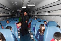 Students from Tafolla Middle School tour Lackland's C-9 Nightingale static display as Fernando Cortez (center), History and Traditions Museum curator, explains the aircraft's history Jan. 14. (U.S. Air Force photo/Alan Boedeker)