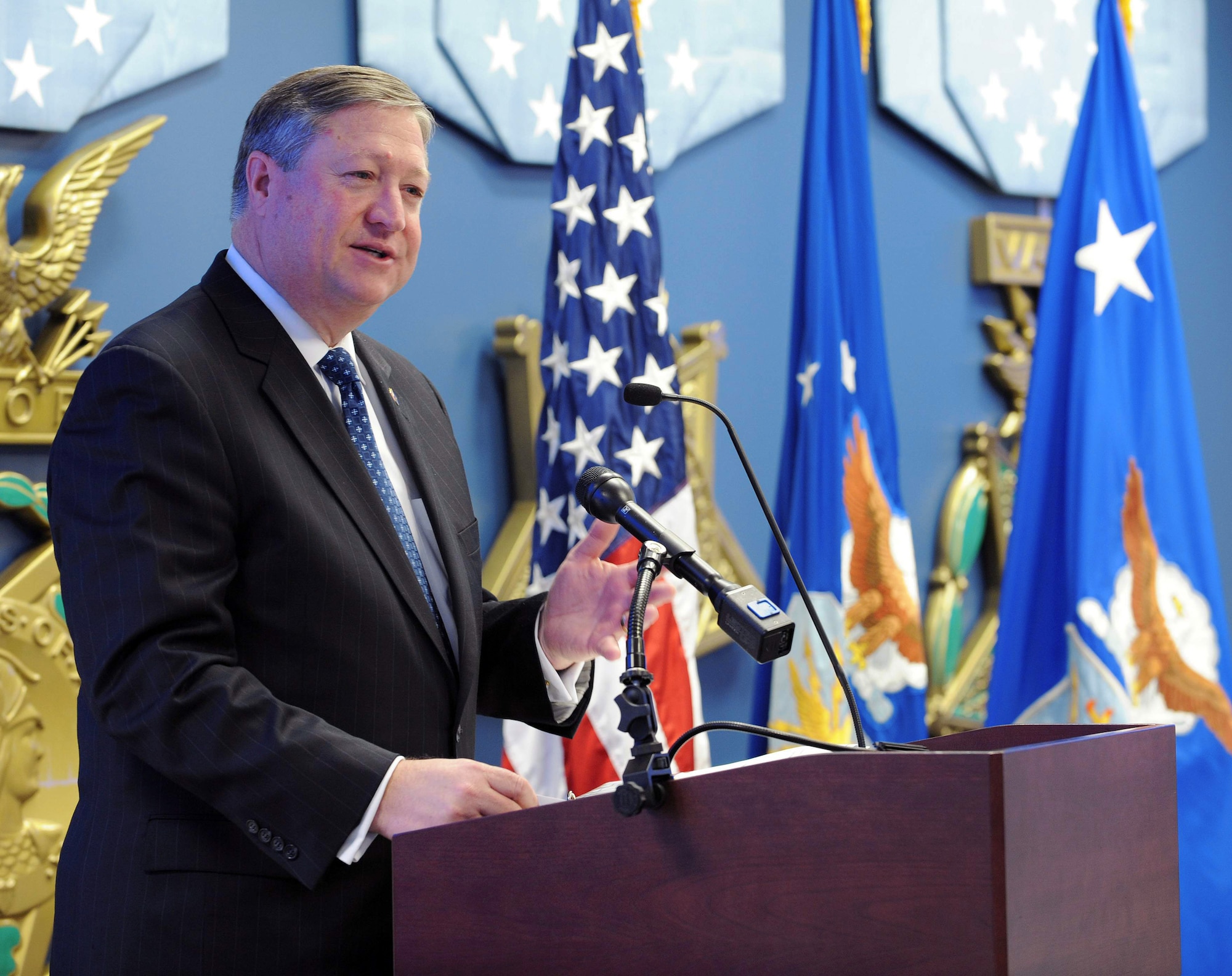 Secretary of the Air Force Michael Donley announces the acceptance of a Fisher House to be built on Dover Air Force Base, Del., during a ceremony to present the Zachary and Elizabeth Fisher Distinguished Civilian Humanitarian Award to Nancy Berglass at the Pentagon's Hall of Heroes Jan. 27, 2010, in Washington, D.C. The multidepartmental award was established in 1996 and is presented to those exemplifying personal qualities of patriotism, generosity, and selfless dedication to improving the quality of life of members of the Armed Forces of the United States. Ms. Berglass serves as lead consultant with the California Community Foundation's Iraq/Afghanistan Deployment Impact Fund. She is credited with distributing more than $245 million to 46 non-profit organizations that provide support services and programs to military members returning from Iraq and Afghanistan and their families. The Fisher House Foundation donates comfort homes built on the grounds of major military and Veterans Affairs medical centers. The homes enable family members to be close to a loved one during the hospitalization for an unexpected illness, disease or injury. The program has provided nearly 3 million days of lodging to family members since it originated in 1990. (U.S. Air Force photo/Jim Varhegyi)