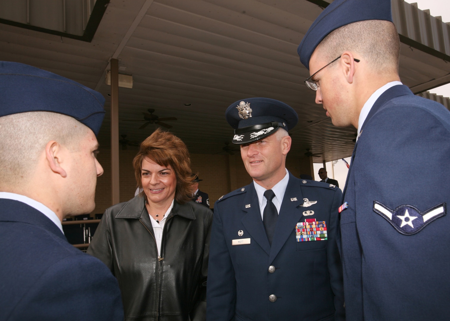 Col. William H. Mott V, 37th Training Wing commander, and his wife Laurie, speak with graduates of Air Force Basic Military Training Jan. 22. Colonel Mott took command of the 37th TRW in July 2009. (U.S. Air Force photo/Robbin Cresswell)  
