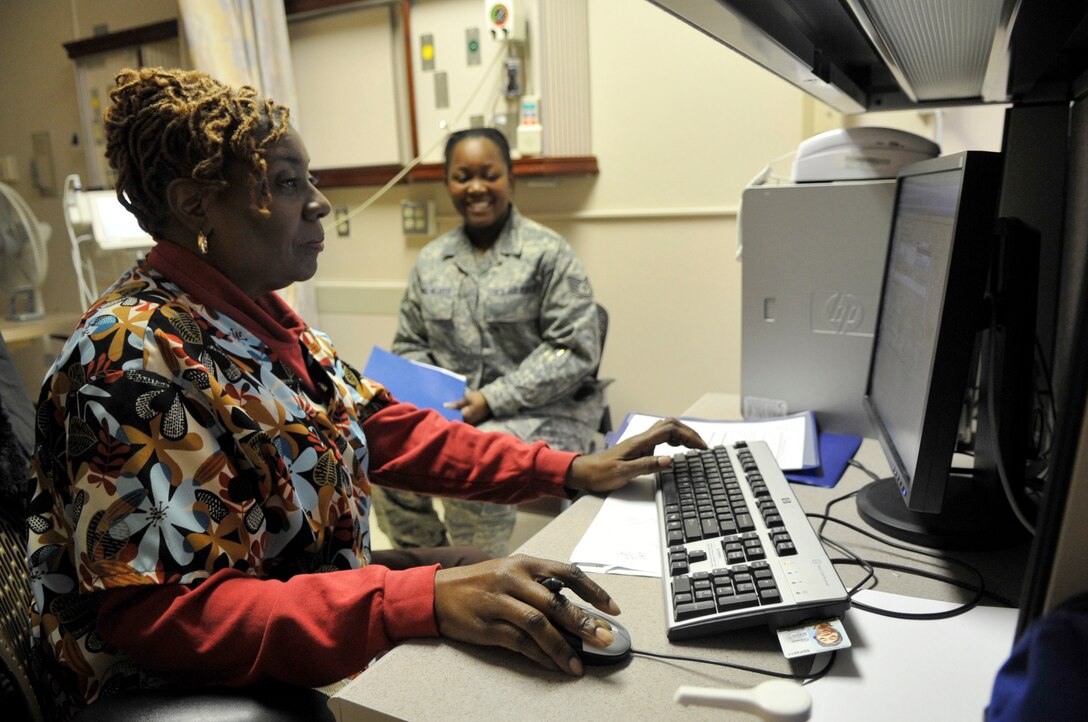 Marcelette Jacquet, a licensed practical nurse with the 779th Medical Operations Squadron's operational medicine clinic, performs a health assessment on Staff Sgt. Latasha Goring-Weaver, an administrative assistant with the 370th Intelligence Surveillance Reconnaissance Group at Fort George G. Meade, Md., during a physical health assessment at Malcolm Grow Medical Center, on Joint Base Andrews, Md., Jan. 19, 2010. The 779 MDOS OMC has recently implemented an AFSO21 program to better serve the Airmen of the NCR by increasing the staff with civilians and creating a mobile team to travel to detached Air Force locations. (U.S. Air Force photo by Staff Sgt. Renae L. Kleckner)(released) 