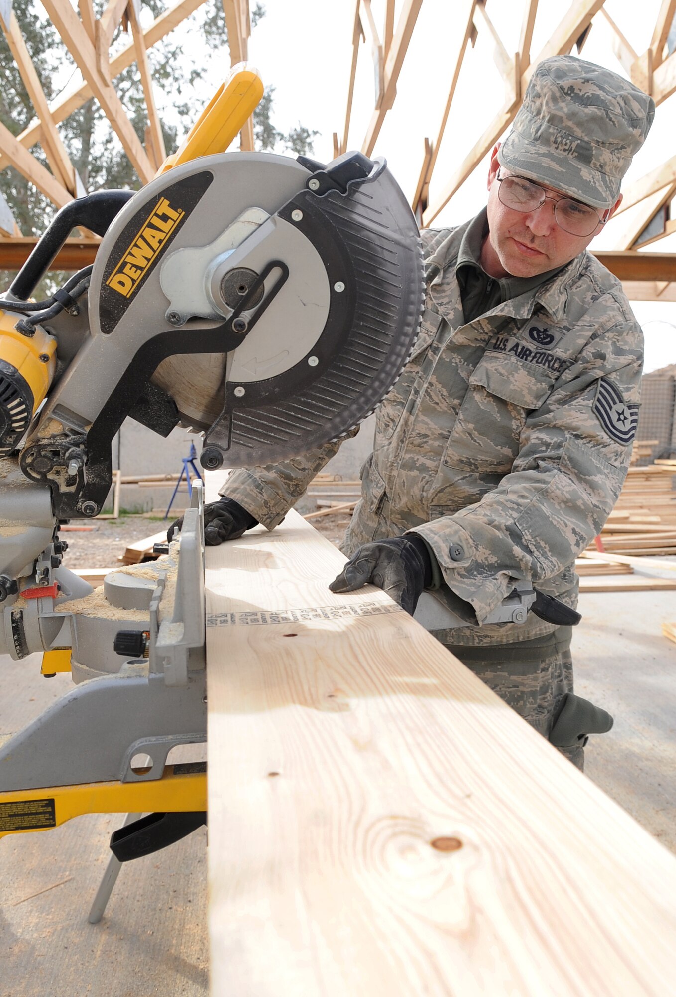 KIRKUK REGIONAL AIR BASE, Iraq – Tech. Sgt. Mark Duran, 506th Expeditionary Civil Engineer Squadron structures technician, builds support beams Jan. 28, 2010.  With a positive attitude and faith, Sergeant Duran is now six years cancer free and grateful for every moment. He is deployed from 301st CES Joint Reserve Field Carswell Fort Worth, Texas. (U.S. Air Force photo/Staff Sgt. Tabitha Kuykendall)	