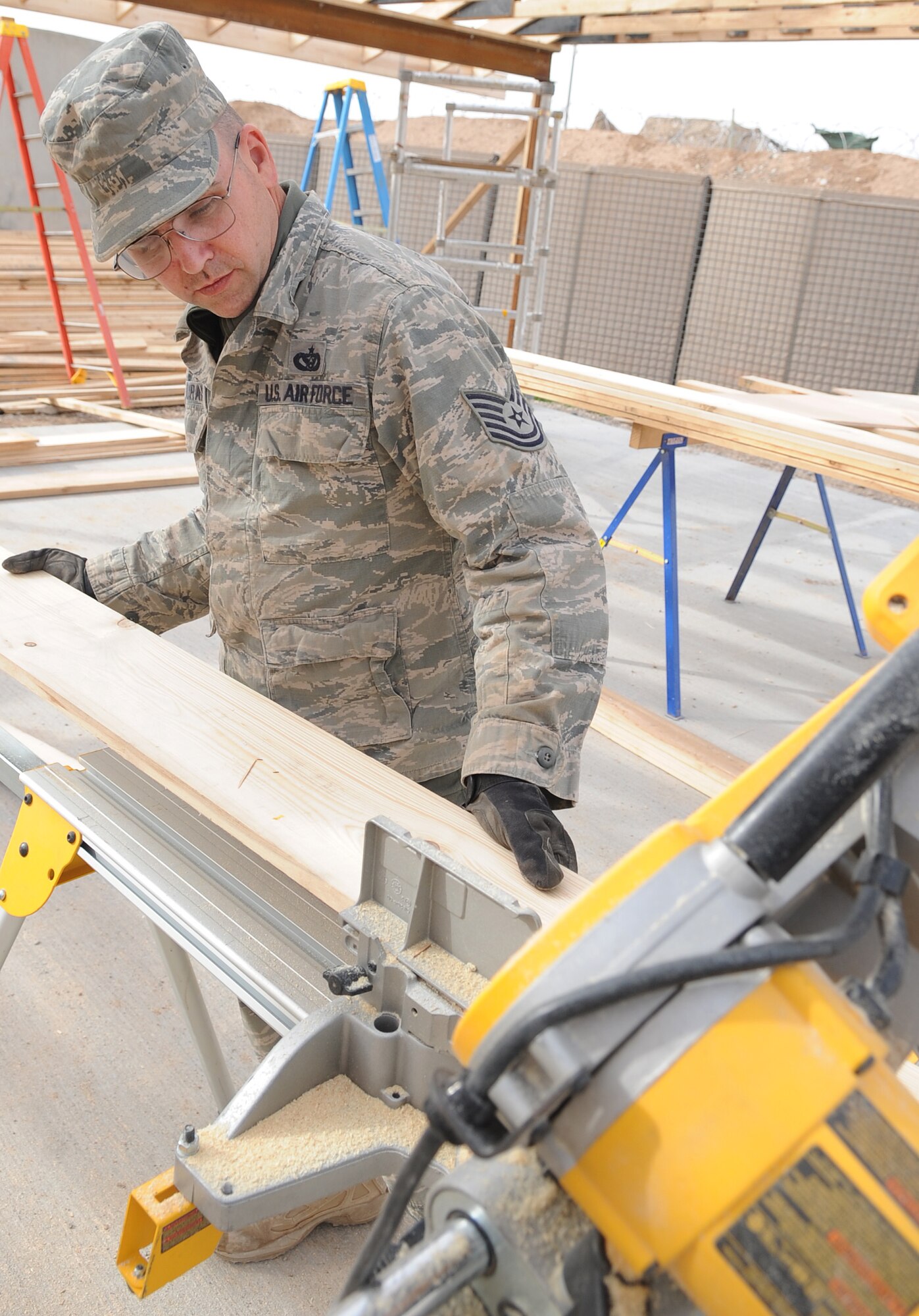 KIRKUK REGIONAL AIR BASE, Iraq – Tech. Sgt. Mark Duran, 506th Expeditionary Civil Engineer Squadron structures technician, builds support beams Jan. 28, 2010.  With a positive attitude and faith, Sergeant Duran is now six years cancer free and grateful for every moment. He is deployed from 301st CES Joint Reserve Field Carswell Fort Worth, Texas. (U.S. Air Force photo/Staff Sgt. Tabitha Kuykendall)	