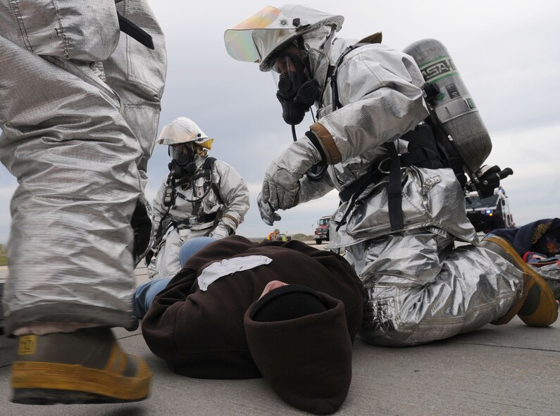 Firefighters simulate helping a wounded victim during an exercise Thursday, Jan. 28, 2010 at Incirlik Air Base, Turkey.  The exercise was held to ensure the wing is mission ready in case of a real world crisis.  (U.S. Air Force photo/Senior Airman Ashley Wood)  