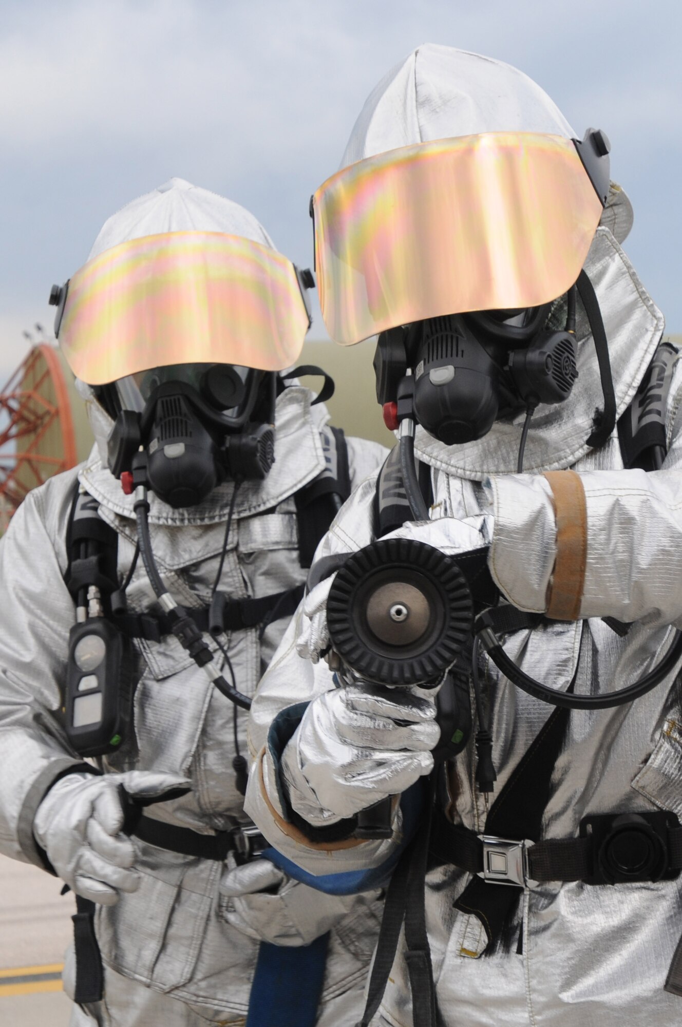 Firefighters simulate extinguishing a fire Thursday, Jan. 28, 2010 during an exercise at Incirlik Air Base, Turkey.  The exercise was held to ensure the wing is mission ready in case of a real world crisis.  (U.S. Air Force photo/Senior Airman Ashley Wood) 