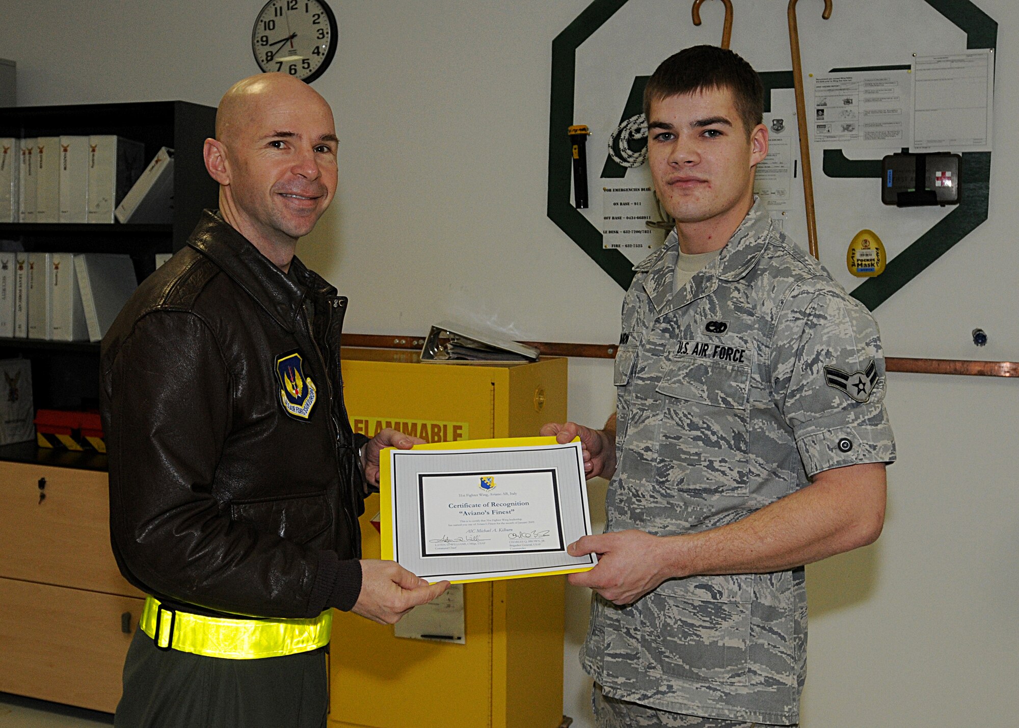 Colonel Patrick McClelland, 31st Fighter Wing vice commander, congratulates Airman 1st Class Michael Kilburn, 31st Maintenance Squadron, on his selection as one of Aviano's Finest.  (U.S. Air Force photo/Senior Airman Tabitha M. Mans)