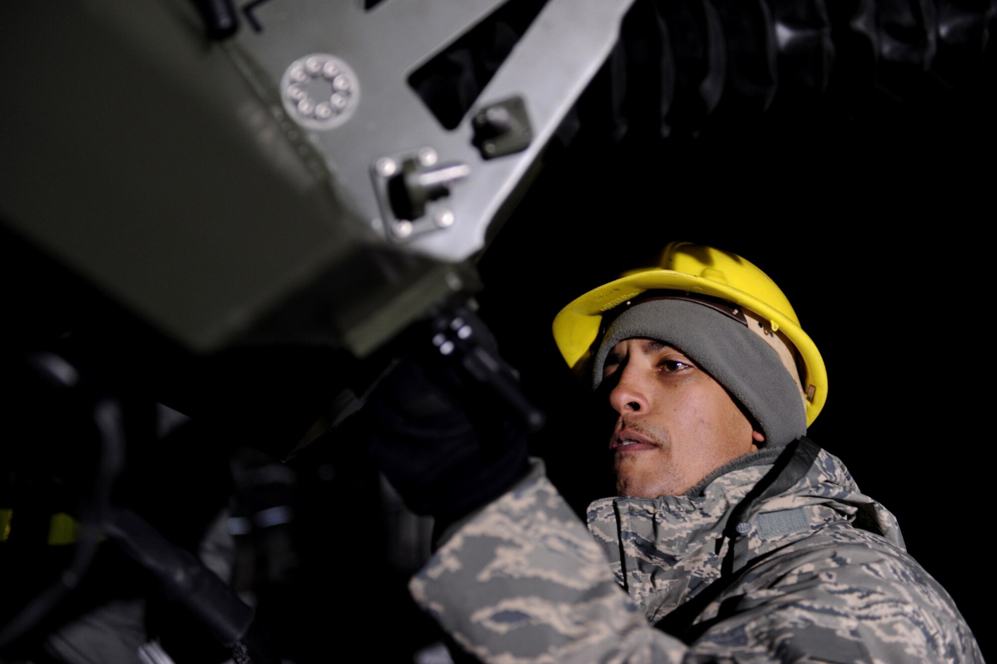 U.S. Air Force Tech. Sgt. Uriah Doss, 1st Combat Communications Squadron, Ramstein Air Base, Germany, sets up a communications satellite at Flugplatz Bitburg, Germany, Jan. 27, 2010, in preparation of Ramstein's operational readiness inspection in September. The units are setting up bare-base operations as part of the dual-wing operational readiness exercise with the 86th Airlift Wing. This is the second of five operational readiness exercises. (U.S. Air Force photo by Staff Sgt. Sarayuth Pinthong)