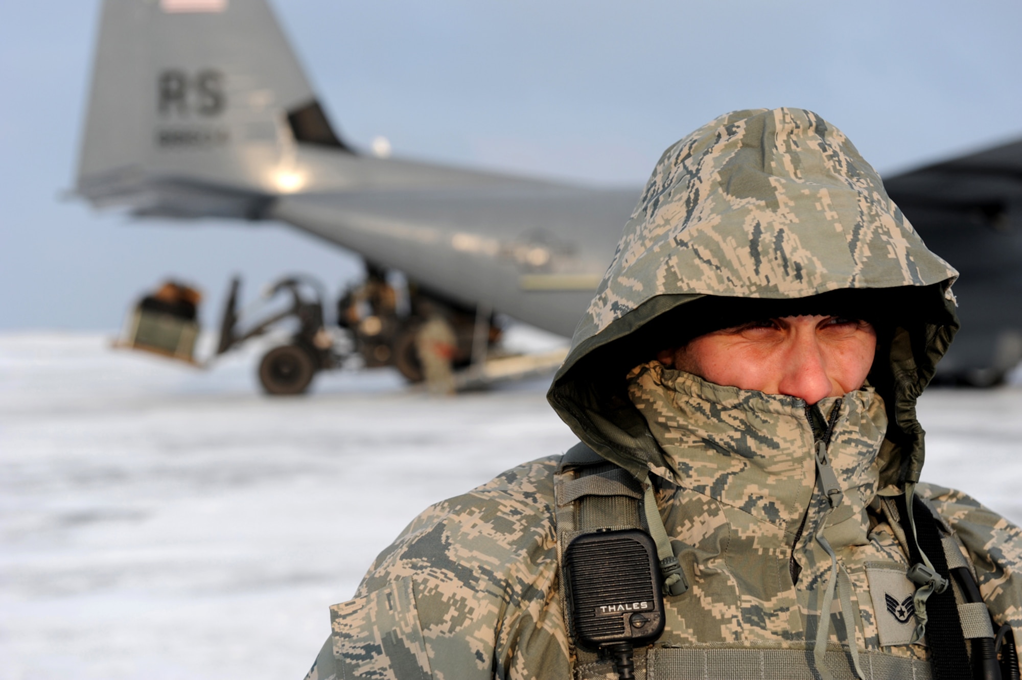 U.S. Air Force Staff Sgt. Joseph Klimaski, 435th Security Forces Squadron, Sembach Annex, Germany, pulls security for a C-130 Hercules out of Ramstein Air Base during cargo off-load at Flugplatz Bitburg, Germany, Jan. 26, 2010, in preparation of Ramstein's operational readiness inspection in September. The units are setting up bare-base operations as part of the dual-wing operational readiness exercise with the 86th Airlift Wing. This is the second of five operational readiness exercises. (U.S. Air Force photo by Staff Sgt. Sarayuth Pinthong)