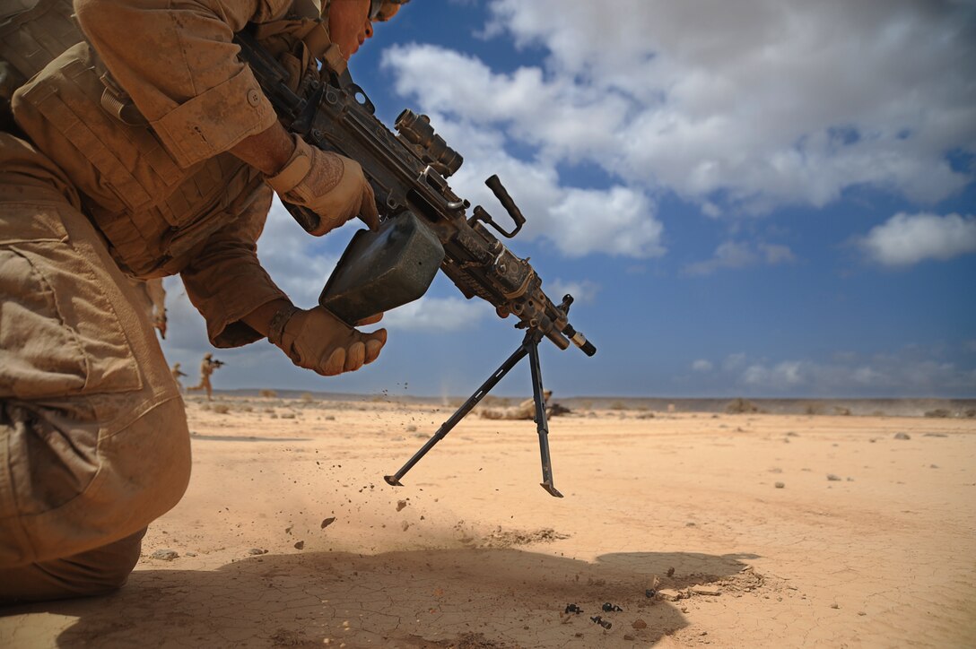 Lance Cpl. Luther Sackett, a rifleman from Rockyford, Co., rushes toward targets during a live-fire and maneuver exercise here Jan. 29. Sackett, and other Marines with Light Armored Reconnaissance Platoon, Weapons Company, Battalion Landing Team 2/4, 11th Marine Expeditionary Unit, conducted live-fire weapons shoots and trained with the French Army Jan. 28-Feb. 5.