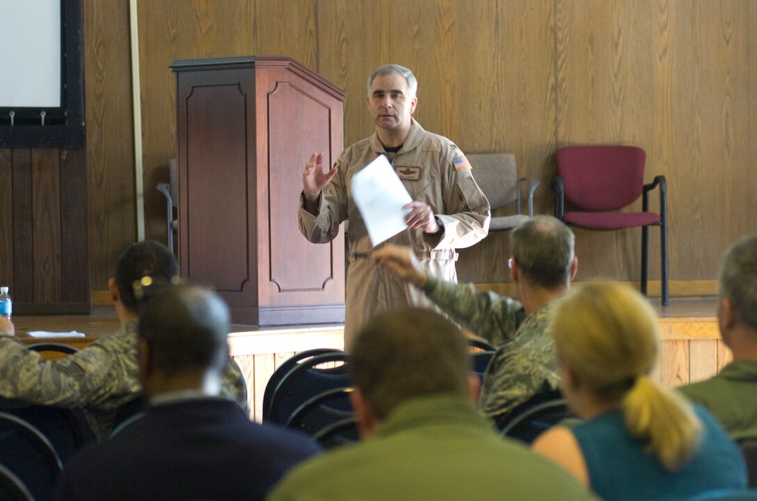 Colonel James Allman, 459th Air Refueling Wing vice commander, fields questions from 459 ARW Airmen and their family members during a deployment briefing on benefits in the wing's auditorium Jan. 27, 2010. (U.S. Air Force photo by Bobby Jones)