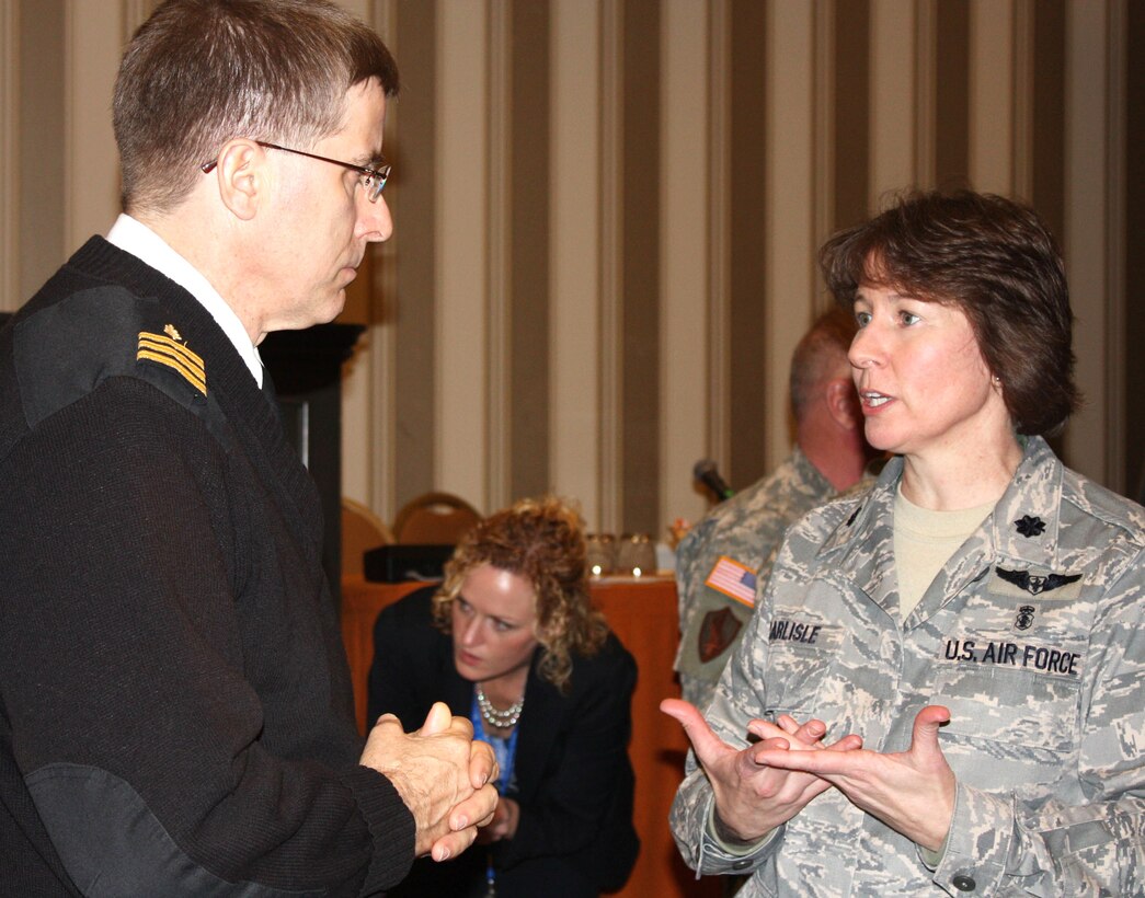 Air Force Lt. Col. Mary Carlisle, a critical care nurse, speaks with a colleague at the 2010 Military Health System Conference at the National Harbor in Prince George’s County, Md., Jan. 26, 2010. Carlisle spoke at the conference of her battle with post-traumatic stress disorder and her eventual healing. (Department of Defense photo by Elaine Wilson)