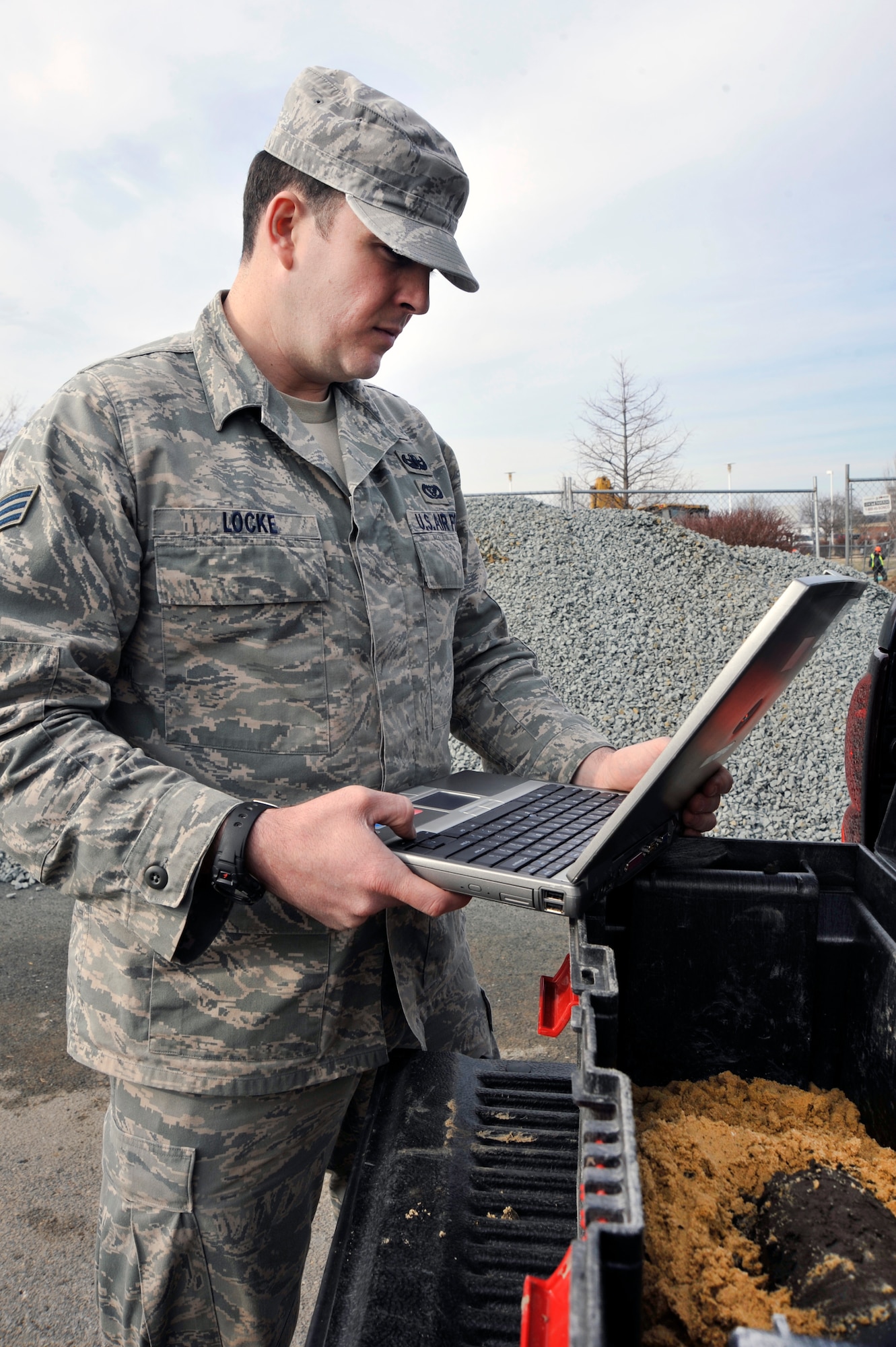 Senior Airman Ryan Locke, 316th Civil Engineer Squadron explosive ordnance disposal technician, uses a laptop computer to identify unexploded ordnance Jan. 20, 2010. Andrews EOD responds to any UXO calls for Joint Bases Andrews, Bolling AFB, and Anacostia Naval Air Station, D.C.. (U.S. Air Force photo by Airman 1st Class Perry Aston)