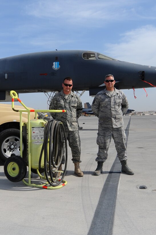 Master Sgts. Alan Andrews (left) and Michael Wingler (right), both 37th Aircraft Maintenance Unit production supervisors, stand in front of the B-1B Lancer that they saved alongside the rescue equipment at a non-disclosed Southwest Asia Jan. 23, 2010. Their actions ensured the safety of four aircrew members and prevented the possible destruction of a munitions-loaded aircraft at a non-disclosed Southwest Asia Jan. 28, 2010. (U.S. Air Force photo by Senior Airman Kasey Zickmund)