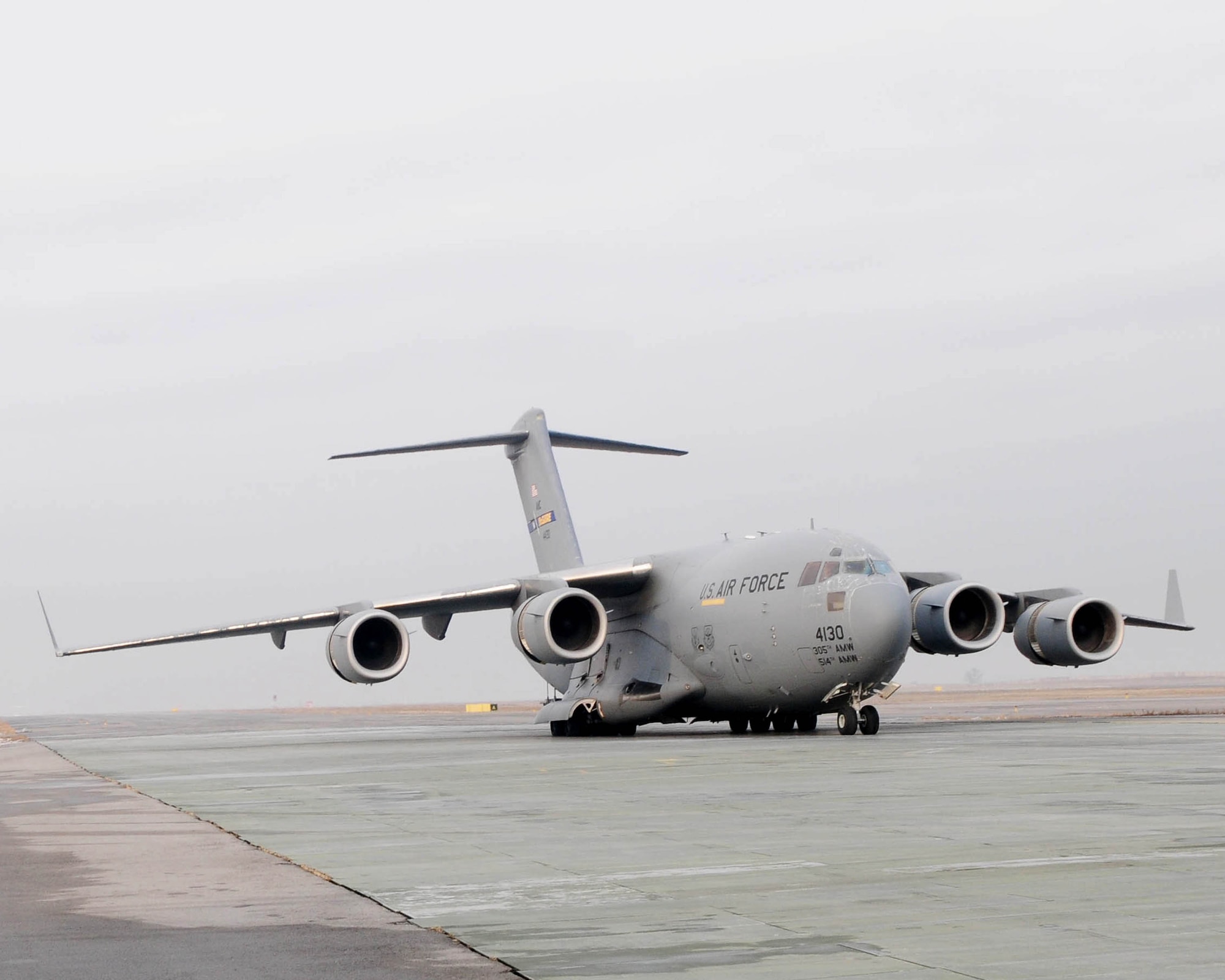 A C-17 Globemaster III sits on the ramp prior to takeoff to Afghanistan at the Transit Center at Manas Jan. 17, 2010. Nearly 7,500 Airmen, Soldiers, Sailors and Marines along with thousands of pounds of equipment are shipped through the Transit Center every week. (U.S. Air Force photo/Senior Airman Nichelle Anderson/released) 