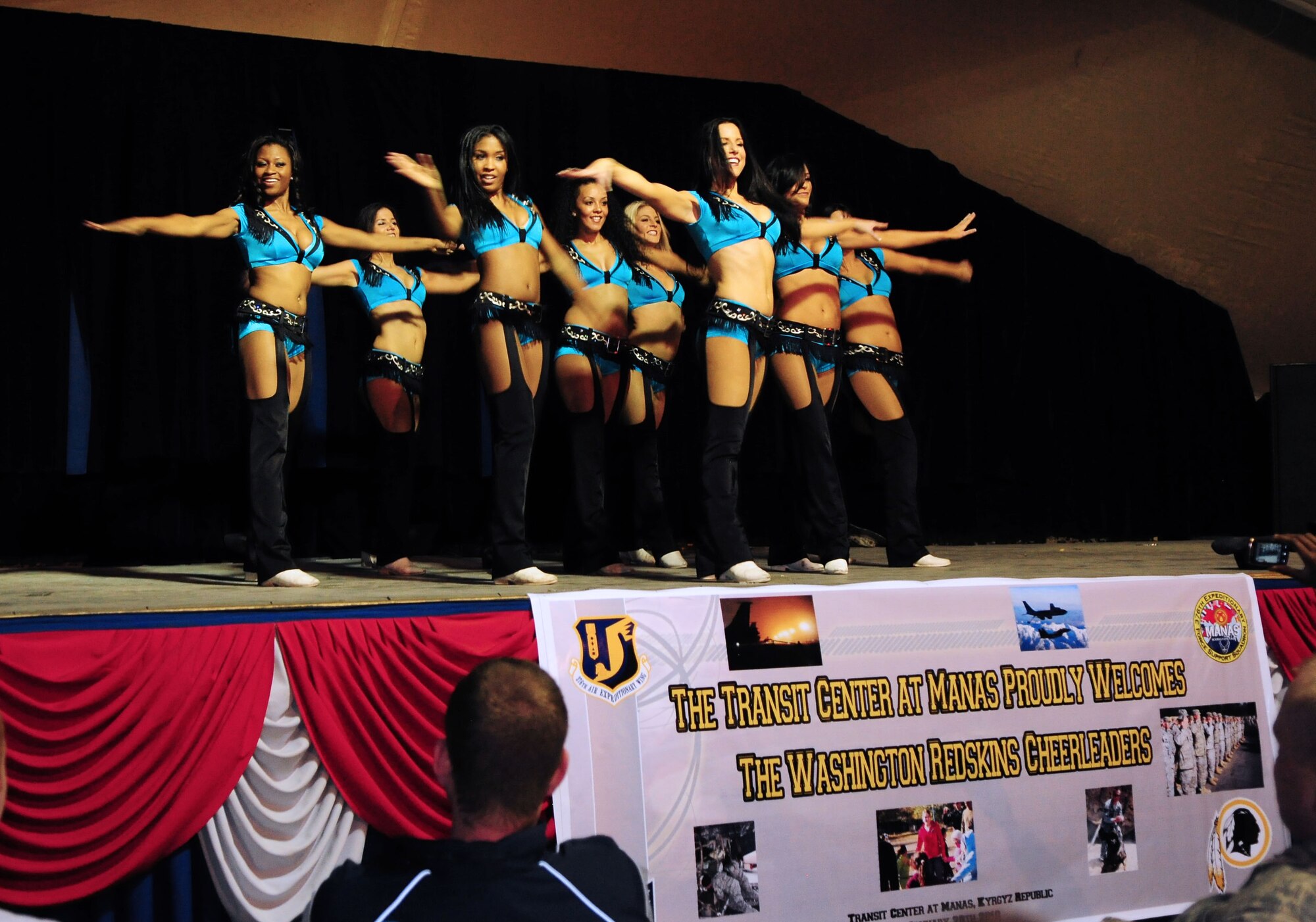 Washington Redskins cheerleaders perform for Airmen, Soldiers, Sailors and Marines deployed or transiting through Transit Center at Manas, Kyrgyzstan, Jan. 28, 2010. The Transit Center is their first stop in a two-week long tour performing for servicemembers deployed to Southwest Asia. (U.S. Air Force photo/Senior Airman Nichelle Anderson/Released)
