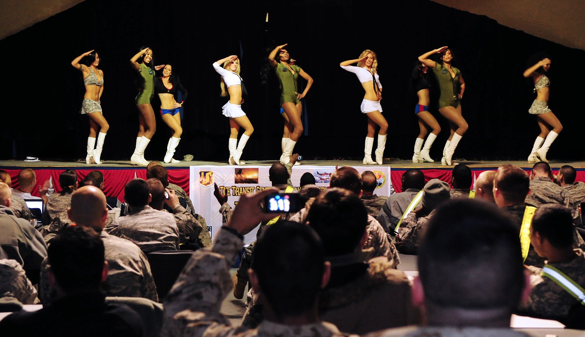 Washington Redskins cheerleaders perform for Airmen, Soldiers, Sailors and Marines deployed or transiting through Transit Center at Manas, Kyrgyzstan, Jan. 28, 2010. The Transit Center is their first stop in a two-week long tour performing for servicemembers deployed to Southwest Asia. (U.S. Air Force photo/Senior Airman Nichelle Anderson/Released)
