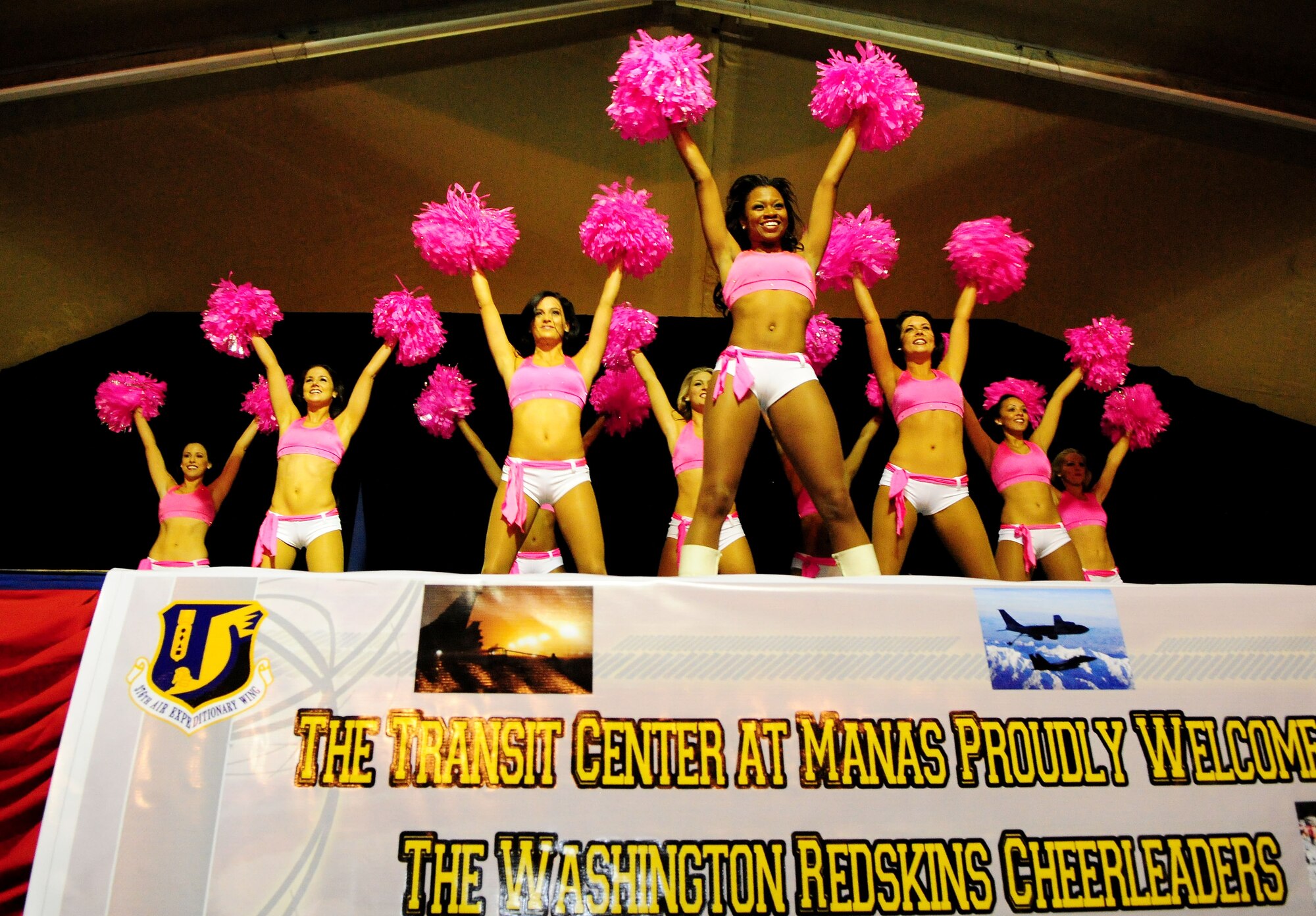 Washington Redskins cheerleaders perform for Airmen, Soldiers, Sailors and Marines deployed or transiting through Transit Center at Manas, Kyrgyzstan, Jan. 28, 2010. The Transit Center is their first stop in a two-week long tour performing for servicemembers deployed to Southwest Asia. (U.S. Air Force photo/Senior Airman Nichelle Anderson/Released)