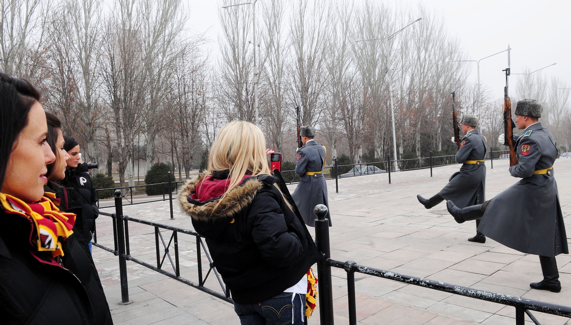 The Washington Redskins cheerleaders watch the changing of the guard during a history and cultural tour of downtown Bishkek, Kyrgyzstan Jan. 27, 2010. The cheerleaders are on tour sponsored by the Armed Forces Entertainment. The Transit Center at Manas is their first stop in a two-week long tour where they will perform for Airmen, Soldiers, Sailors and Marines deployed overseas. (U.S. Air Force photo/Senior Airman Nichelle Anderson/Released)