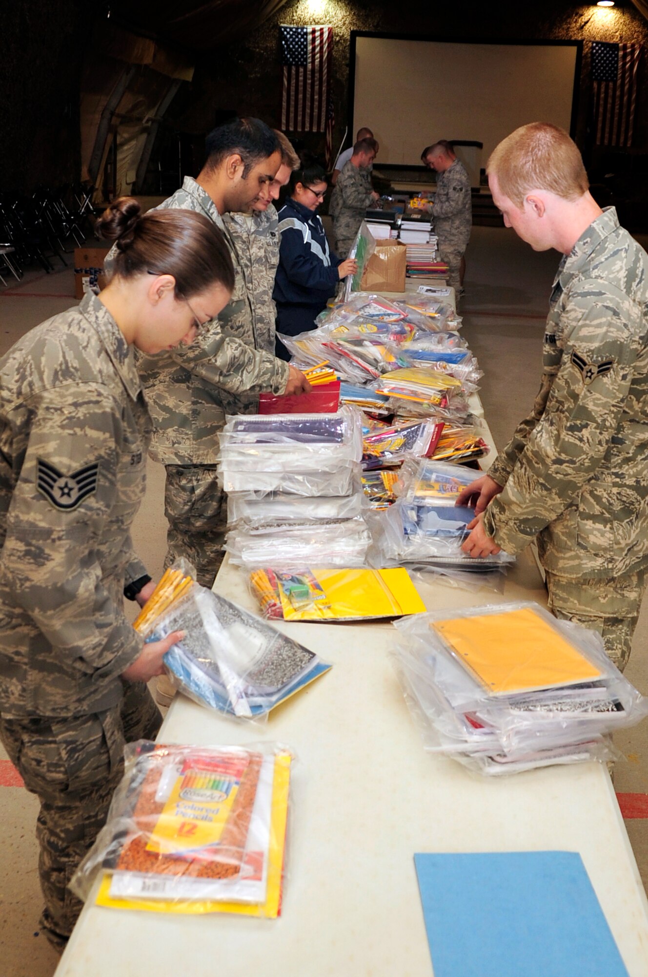 Ali Airmend sort, prepare and package school items headed to local Iraqi school children.  The supplies are donated by stateside organizations through thte efforts of Airmen stationed here.  (U.S. Air Force photo/Released)
