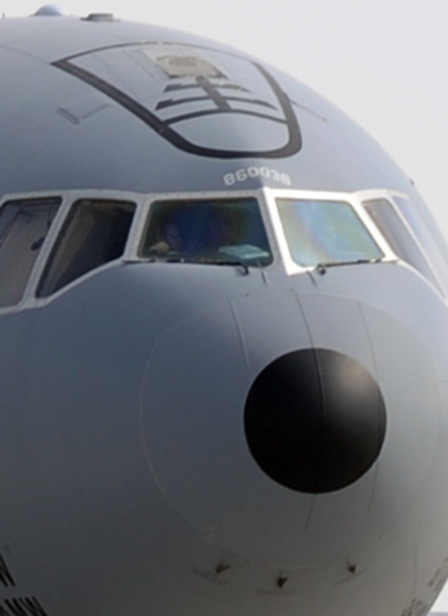 A KC-10 Extender aircrew guides a KC-10 out its parking space in preparation for a combat air refueling mission from a non-disclosed Southwest Asia base on Jan. 28, 2010.  The KC-10 is assigned to the 908th Expeditionary Air Refueling Squadron and is from Travis Air Force Base, Calif. (U.S. Air Force Photo/Tech. Sgt. Scott T. Sturkol/Released)