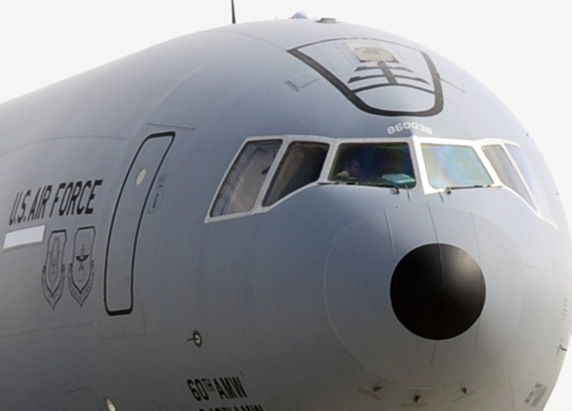 A KC-10 Extender aircrew guides a KC-10 out its parking space in preparation for a combat air refueling mission from a non-disclosed Southwest Asia base on Jan. 28, 2010.  The KC-10 is assigned to the 908th Expeditionary Air Refueling Squadron and is from Travis Air Force Base, Calif. (U.S. Air Force Photo/Tech. Sgt. Scott T. Sturkol/Released)