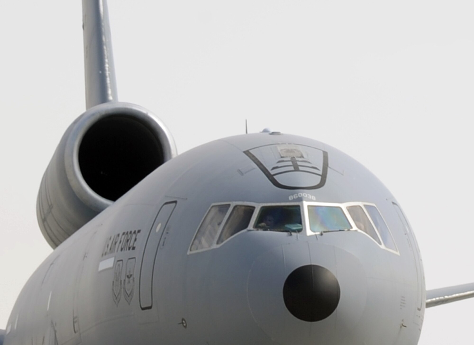 A KC-10 Extender aircrew guides a KC-10 out its parking space in preparation for a combat air refueling mission from a non-disclosed Southwest Asia base on Jan. 28, 2010.  The KC-10 is assigned to the 908th Expeditionary Air Refueling Squadron and is from Travis Air Force Base, Calif. (U.S. Air Force Photo/Tech. Sgt. Scott T. Sturkol/Released)