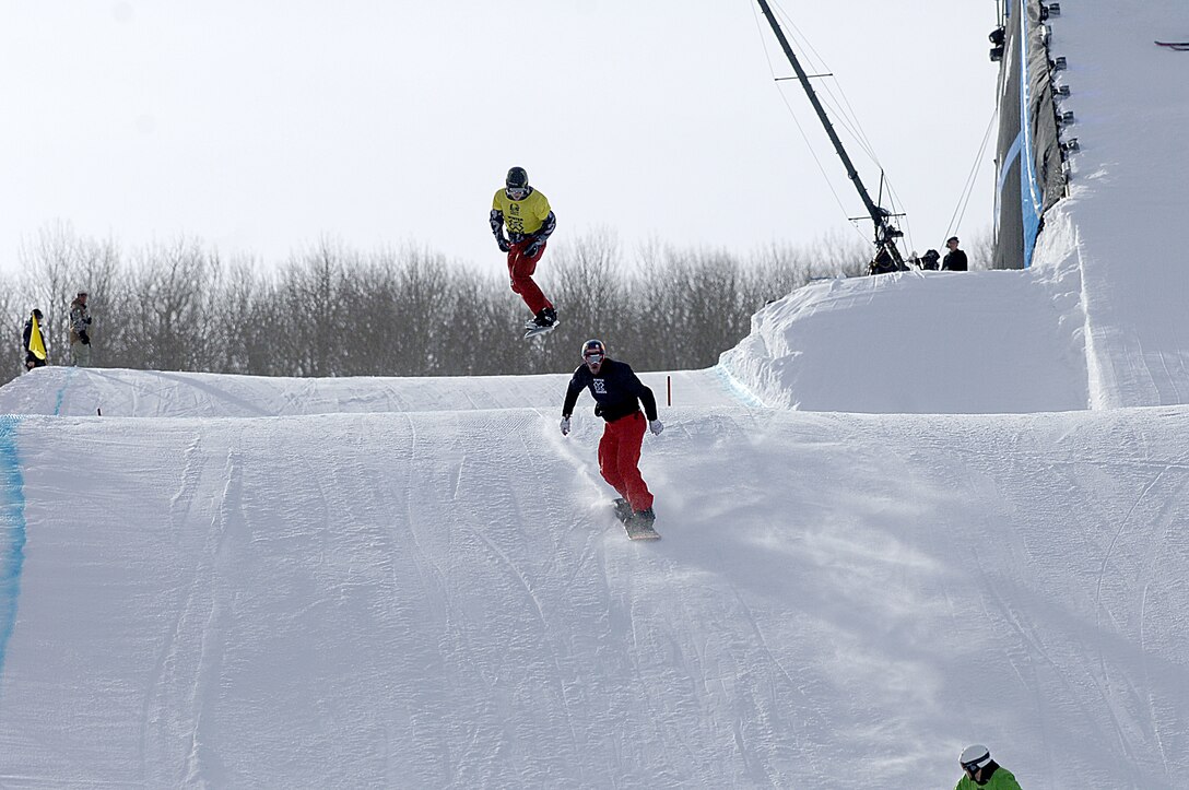 Professional snowboarders hit the trails and show off their tricks during the 2010 Winter X-Games in Aspen, Colo., Jan 29. This is the ninth consecutive year the games have been held in Aspen and the first year Marines from  Marine Corps Recruit Depot San Diego's Single Marine Program were able to attend.