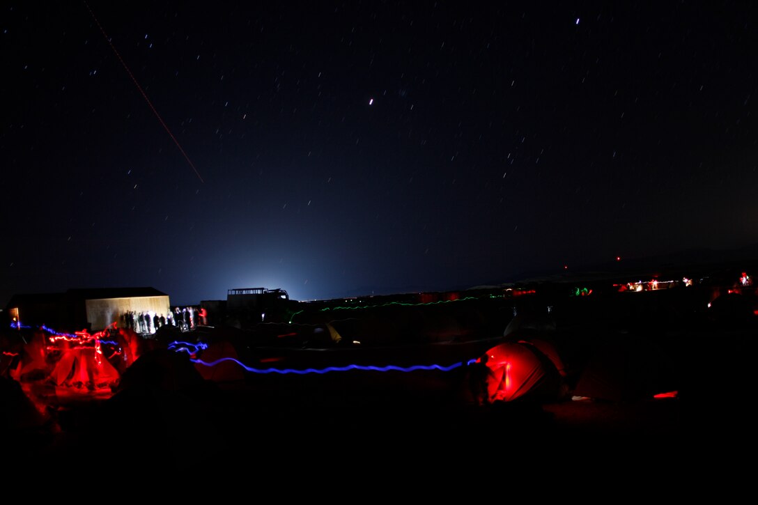 Marines and sailors with 3rd Battalion, 1st Marine Regiment, from Marine Corps Base Camp Pendleton, Calif., move around their forward operating base Jan. 31, at Combat Center Range 220. The battalion recently completed the predeployment training exercise known as Enhanced Mojave Viper.
