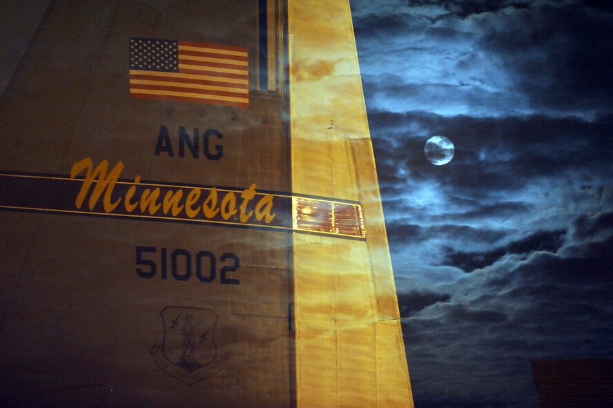 The tail of a C-130 Hercules from the 133rd Airlift Wing, Minnesota Air National Guard, in moonlight at the Minneapolis St. Paul International Airport January 30, 2010. The C-130 Hercules primarily performs the tactical portion of the airlift mission. The aircraft is capable of operating from rough, dirt strips and is the prime transport for air dropping troops and equipment into hostile areas. United States Air Force photo by Tech Sgt Erik Gudmundson (Released)