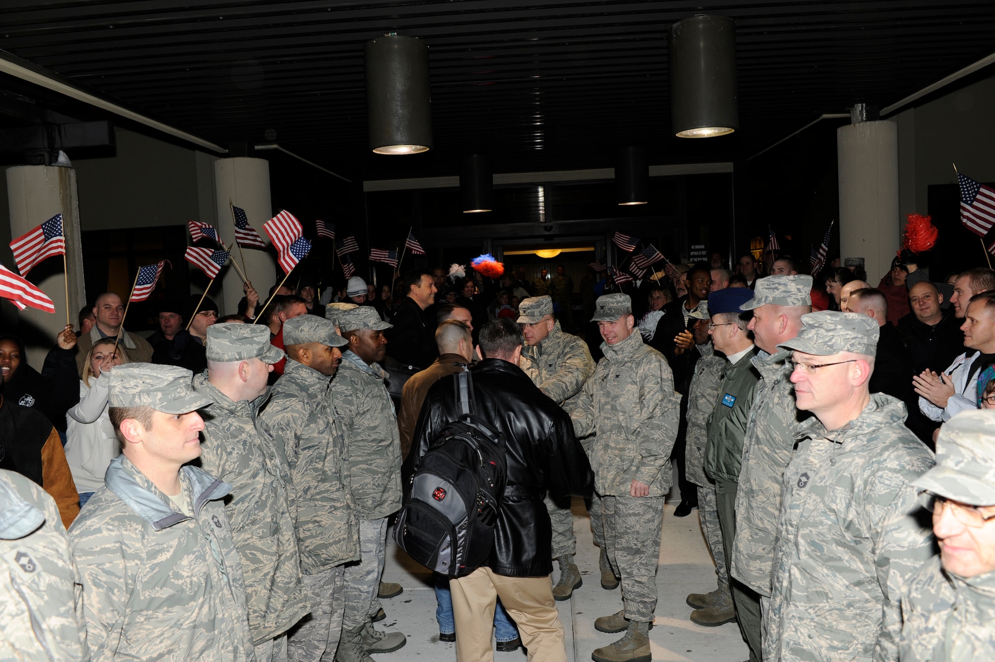 (Center) Col. Manson Morris, 436th Airlift Wing commander, and Col. Randal Bright, 512th Airlift Wing commander, welcome the Installation Excellence Selection Board members to Dover Air Force Base Jan. 31, while members of Team Dover cheer. Team Dover is competing for the 2010 Commander-in-Chief’s Annual Award for Installation Excellence, which recognizes the outstanding efforts of the people who operate and maintain Air Force installations and who have done the best with their resources to support the mission. (U.S. Air Force photo/Jason Minto)