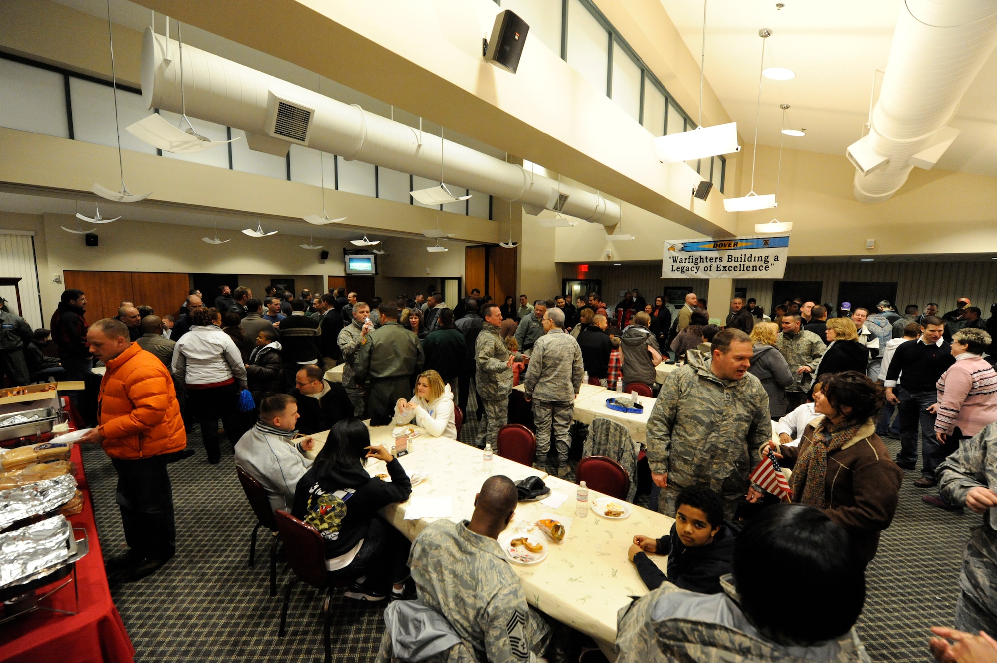 Team Dover members gather to welcome the Installation Excellence Selection Board to Dover Air Force Base Jan. 31. The IESB will evaluate 26 mission areas at Dover during more than 100 briefings to determine the 2010 Commander-in-Chief’s Annual Award for Installation Excellence winner. Dover was the first Air Mobility Command installation to receive this award in 2008. (U.S. Air Force photo/Jason Minto)