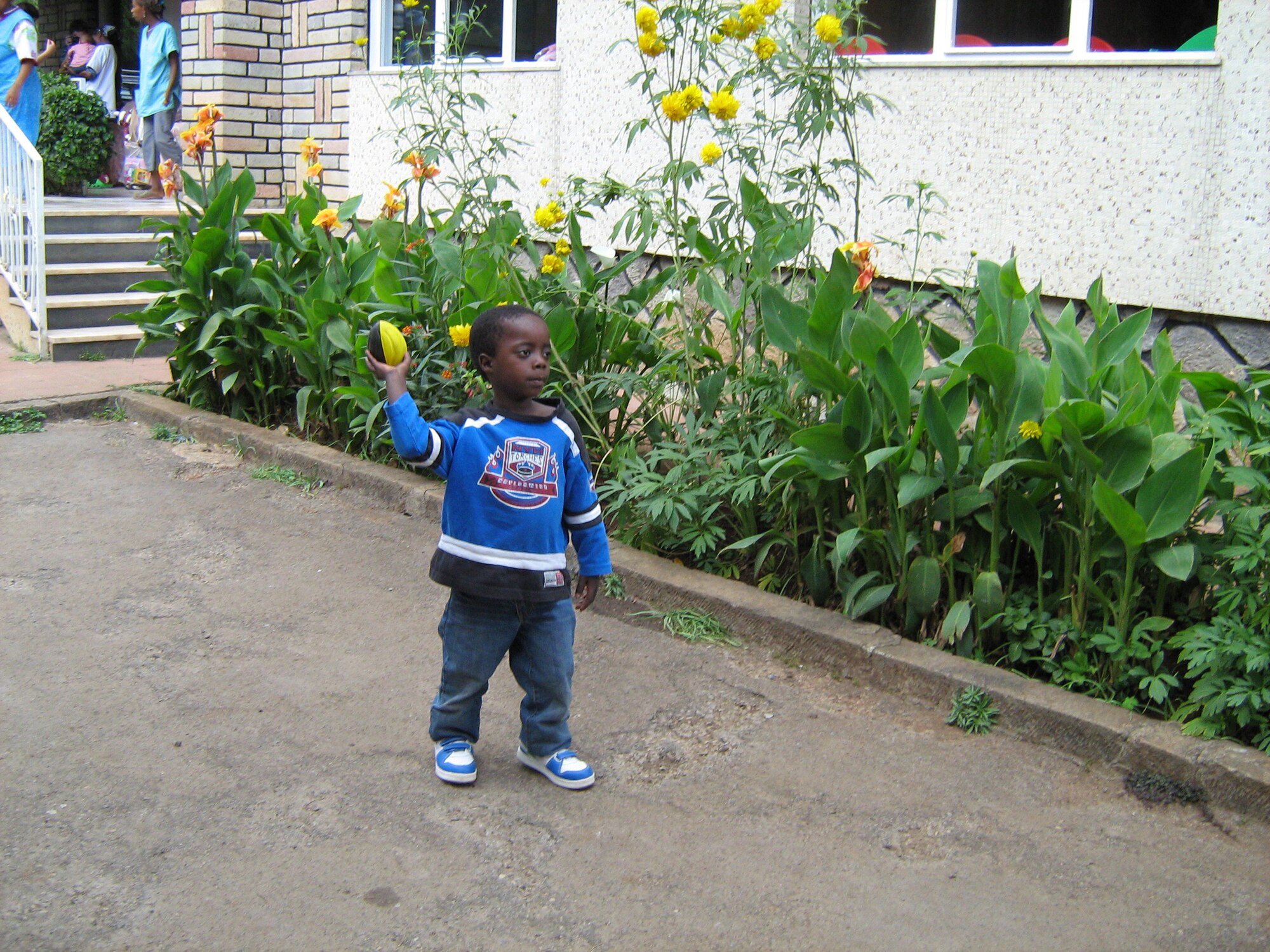 Caleb, age 5, plays outside his home in Ethiopia in January 2010. Caleb was adopted by Col. John Marselus, 607th Air and Space Operations Center Commander, and his wife Kim. (Courtesy photo) 