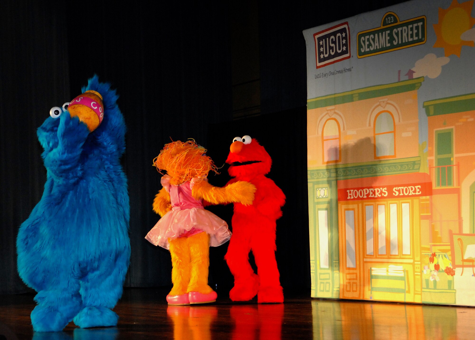 Some of Sesame Street's most famous characters perform during the Sesame Street/United Service Organizations' Experience for Military Families show Jan. 30. More than 1,600 people packed into the Keystone Theater for two free shows that highlighted community support for military families and helped children learn how to cope with stress associated with military life. Due to overwhelming demand, Sesame Street and the USO will host an additional performance at the Camp Courtney gym Feb. 3 at 3 and 6 p.m. (U.S. Air Force photo by Staff Sgt. Jason Lake)