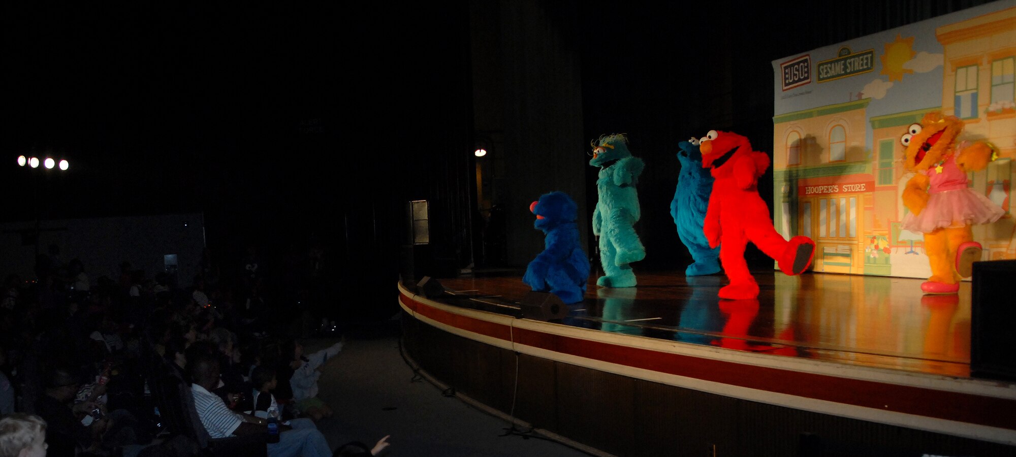 Some of Sesame Street's most famous characters perform during the Sesame Street/United Service Organizations' Experience for Military Families show Jan. 30. More than 1,600 people packed into the Keystone Theater for two free shows that highlighted community support for military families and helped children learn how to cope with stress associated with military life. Due to overwhelming demand, Sesame Street and the USO will host an additional performance at the Camp Courtney gym Feb. 3 at 3 and 6 p.m. (U.S. Air Force photo by Staff Sgt. Jason Lake)