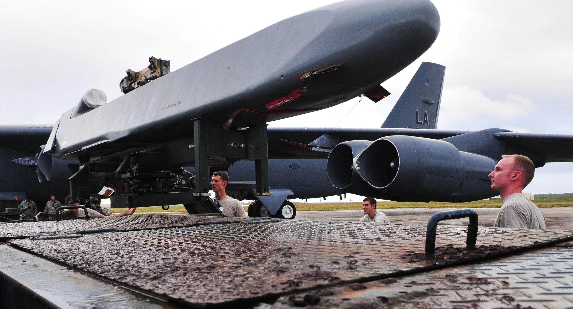 ANDERSEN AIR FORCE BASE, Guam - Airmen from the 36th Expeditionary Aircraft Maintenance Squadron load a conventional air launch cruise missile onto a B-52 during a recent operational readiness exercise here.  The Airmen are deployed to the 36th Wing from the 2nd Aircraft Maintenance Squadron, Barksdale AFB, La., as part of U.S. Pacific Command's continuous bomber presence. The mission of the 36th Wing is to employ, deploy, integrate and enable air and space forces from the most forward U.S. sovereign Air Force base in the Pacific.  (U.S. Air Force photo by Airman 1st Class Julian North)