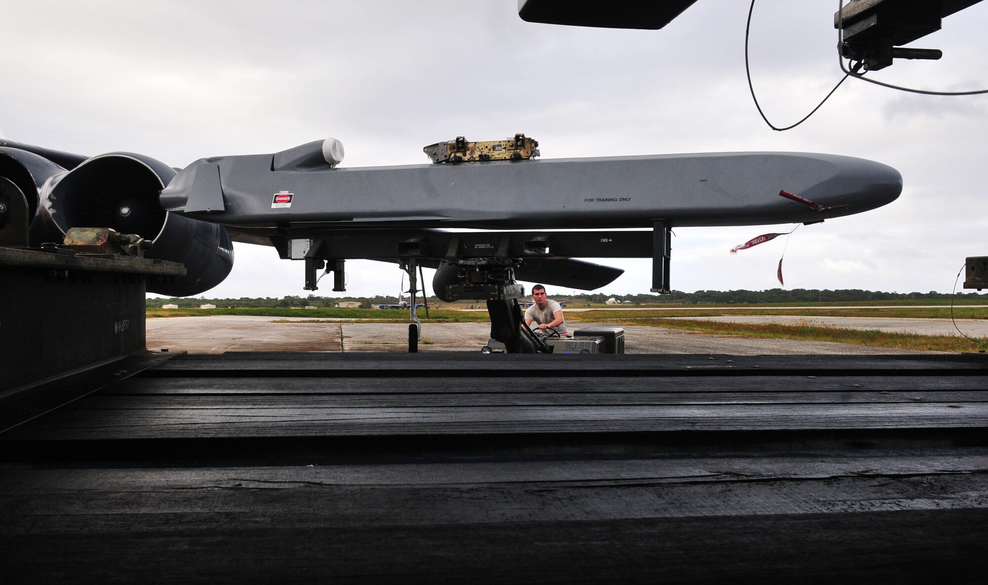 ANDERSEN AIR FORCE BASE, Guam - Airmen from the 36th Expeditionary Aircraft Maintenance Squadron load a conventional air launch cruise missile onto a B-52 during a recent operational readiness exercise here.  The Airmen are deployed to the 36th Wing from the 2nd Aircraft Maintenance Squadron, Barksdale AFB, La., as part of U.S. Pacific Command's continuous bomber presence. The mission of the 36th Wing is to employ, deploy, integrate and enable air and space forces from the most forward U.S. sovereign Air Force base in the Pacific.  (U.S. Air Force photo by Airman 1st Class Julian North)