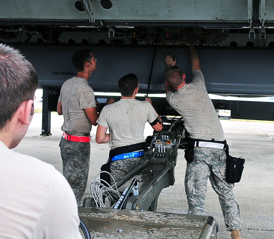ANDERSEN AIR FORCE BASE, Guam - Airmen from the 36th Expeditionary Aircraft Maintenance Squadron load a conventional air launch cruise missile onto a B-52 during a recent operational readiness exercise here.  The Airmen are deployed to the 36th Wing from the 2nd Aircraft Maintenance Squadron, Barksdale AFB, La., as part of U.S. Pacific Command's continuous bomber presence. The mission of the 36th Wing is to employ, deploy, integrate and enable air and space forces from the most forward U.S. sovereign Air Force base in the Pacific.  (U.S. Air Force photo by Airman 1st Class Julian North)