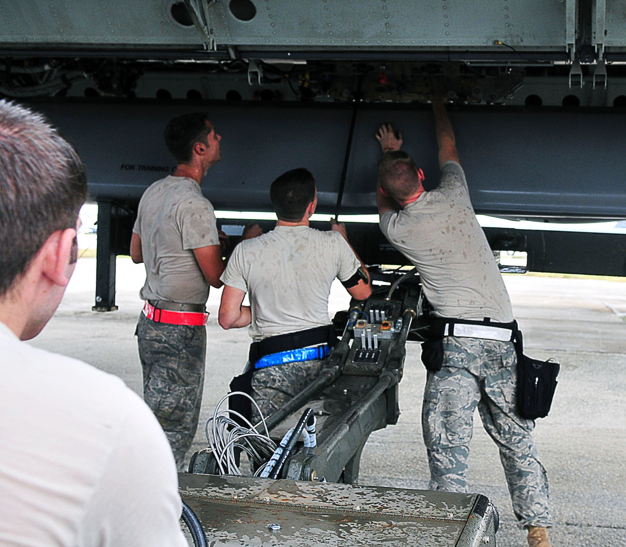 ANDERSEN AIR FORCE BASE, Guam - Airmen from the 36th Expeditionary Aircraft Maintenance Squadron load a conventional air launch cruise missile onto a B-52 during a recent operational readiness exercise here.  The Airmen are deployed to the 36th Wing from the 2nd Aircraft Maintenance Squadron, Barksdale AFB, La., as part of U.S. Pacific Command's continuous bomber presence. The mission of the 36th Wing is to employ, deploy, integrate and enable air and space forces from the most forward U.S. sovereign Air Force base in the Pacific.  (U.S. Air Force photo by Airman 1st Class Julian North)