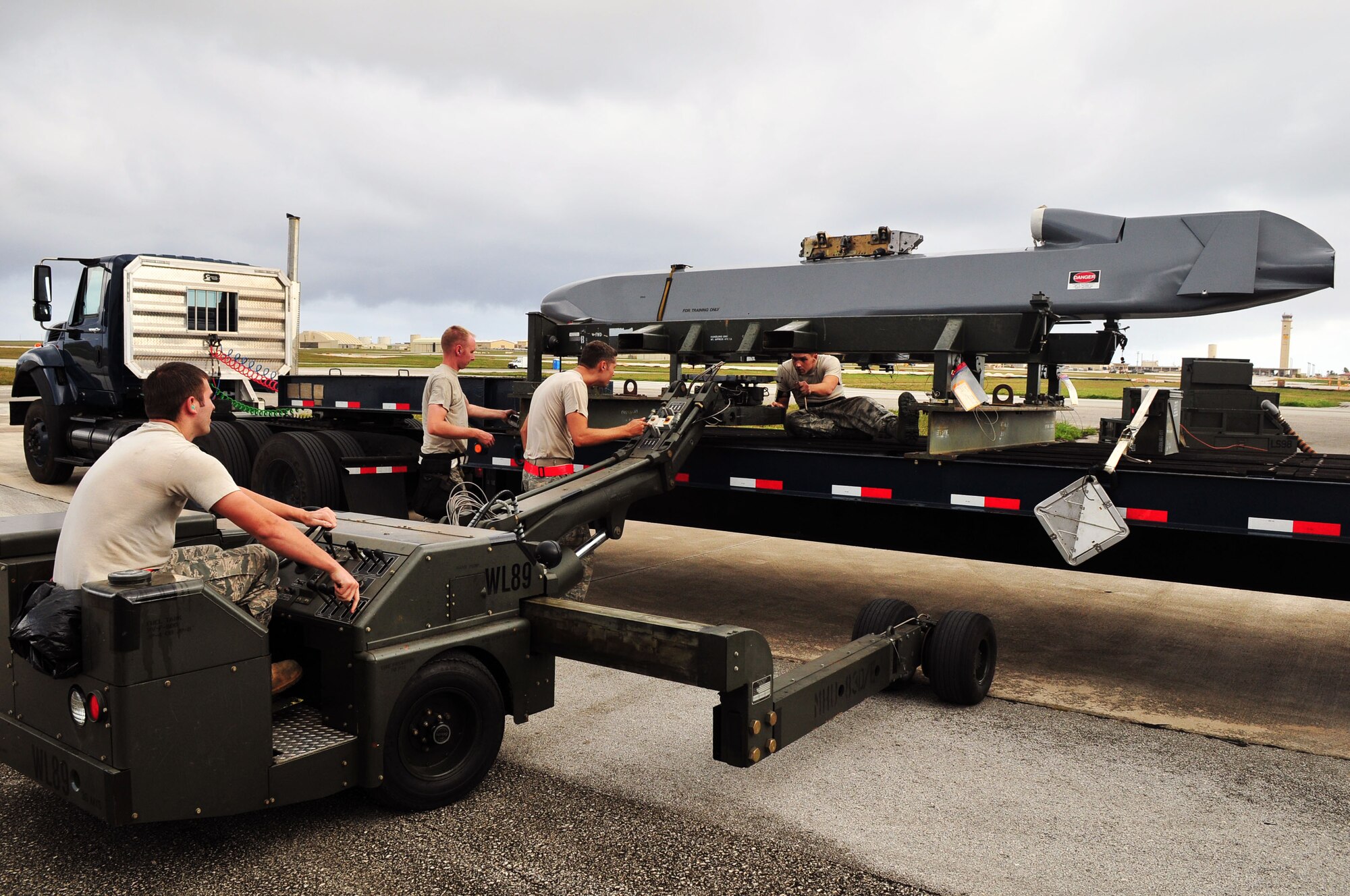 ANDERSEN AIR FORCE BASE, Guam - Airmen from the 36th Expeditionary Aircraft Maintenance Squadron load a conventional air launch cruise missile onto a B-52 during a recent operational readiness exercise here.  The Airmen are deployed to the 36th Wing from the 2nd Aircraft Maintenance Squadron, Barksdale AFB, La., as part of U.S. Pacific Command's continuous bomber presence. The mission of the 36th Wing is to employ, deploy, integrate and enable air and space forces from the most forward U.S. sovereign Air Force base in the Pacific.  (U.S. Air Force photo by Airman 1st Class Julian North)